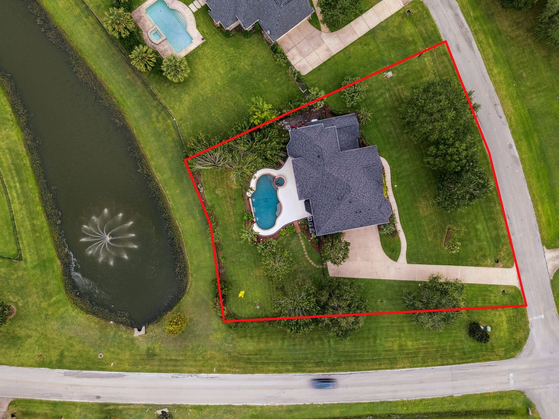 8826 Crown Jewel Drive, Richmond, TX 77469 Experience luxury living with this expansive property featuring a sparkling pool and spa, lush landscaping, and a convenient side-entry 3-car garageall captured in a stunning birds-eye view.