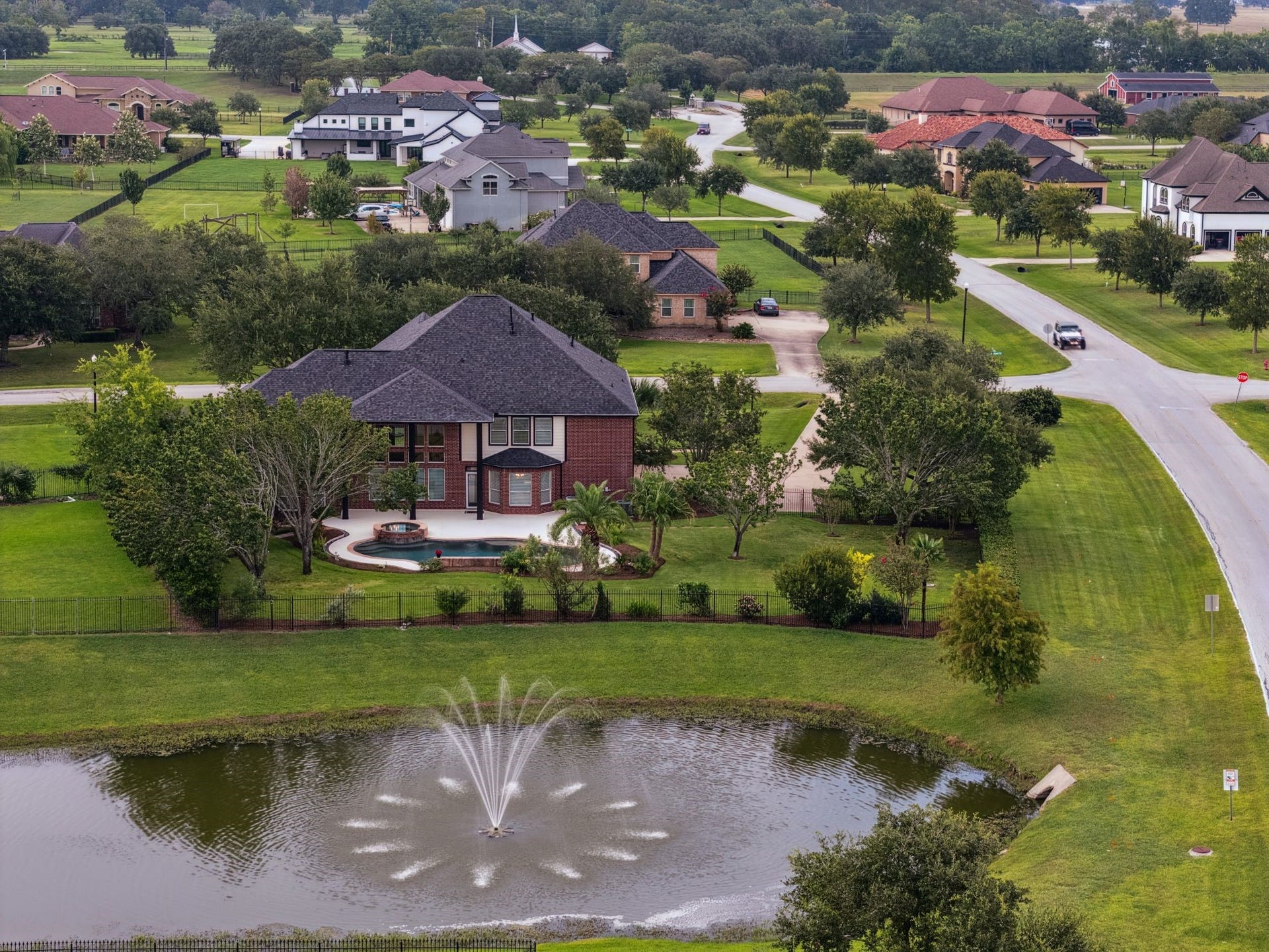 8826 Crown Jewel Drive, Richmond, TX 77469 Discover this stunning 2-story brick home, nestled in a lush landscape with a private pool, offering a perfect blend of elegance and tranquility.