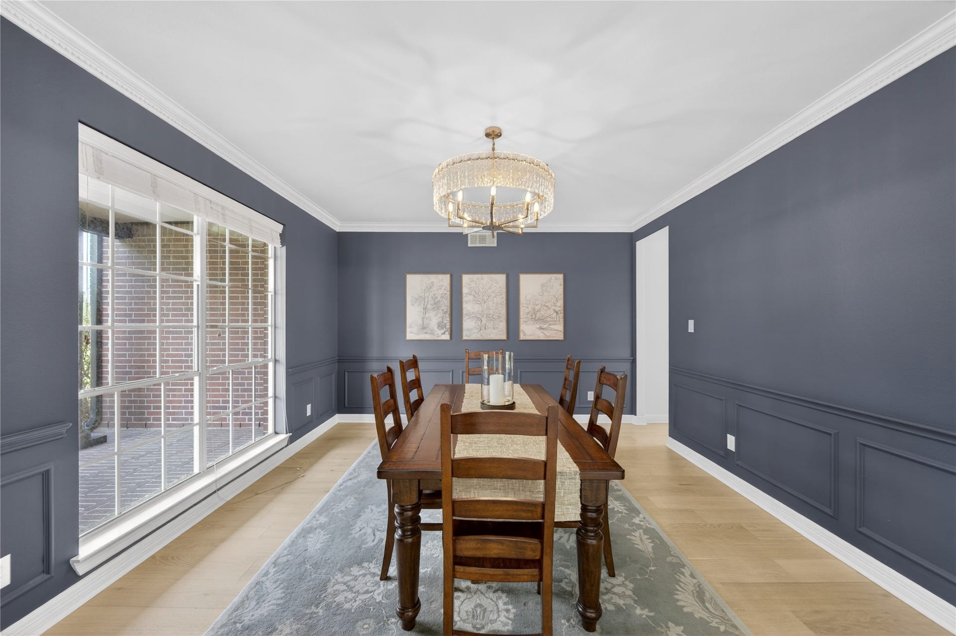 8826 Crown Jewel Drive, Richmond, TX 77469 Fanciful dinners or a casual romantic dinner for two are elevated in the formal dining room. Thick white crown molding and the delicate light fixture add just the right amount of opulence for a chic dining experience.