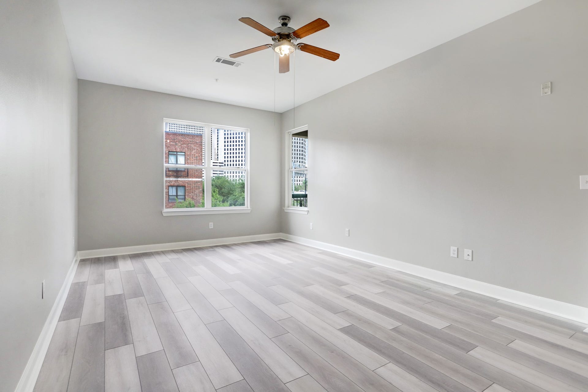 300 St Joseph Parkway, #212, Houston, TX 77002 The huge (21x13) Primary Bedroom has views onto downtown.