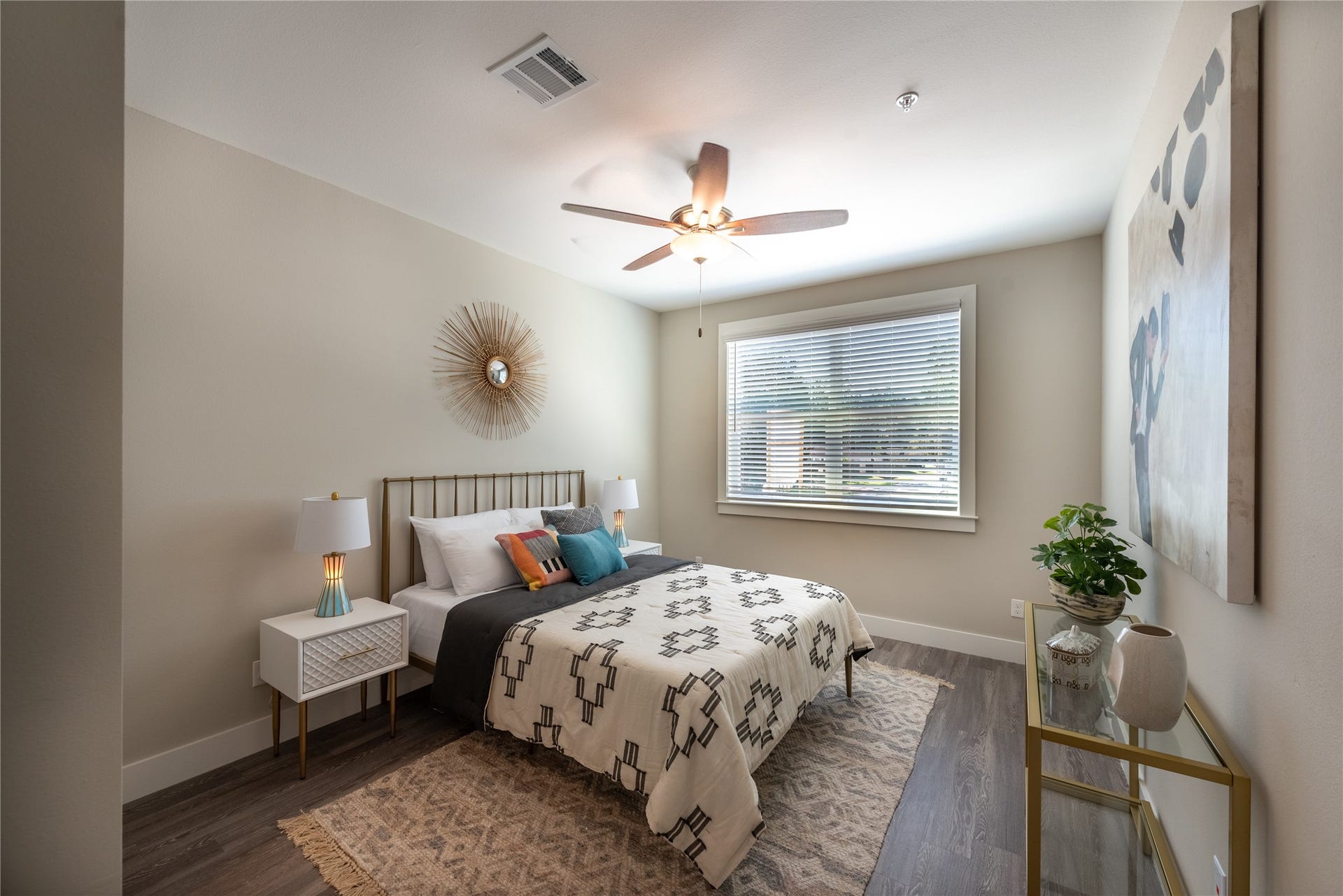 Bright and inviting bedroom with large window offering natural light
