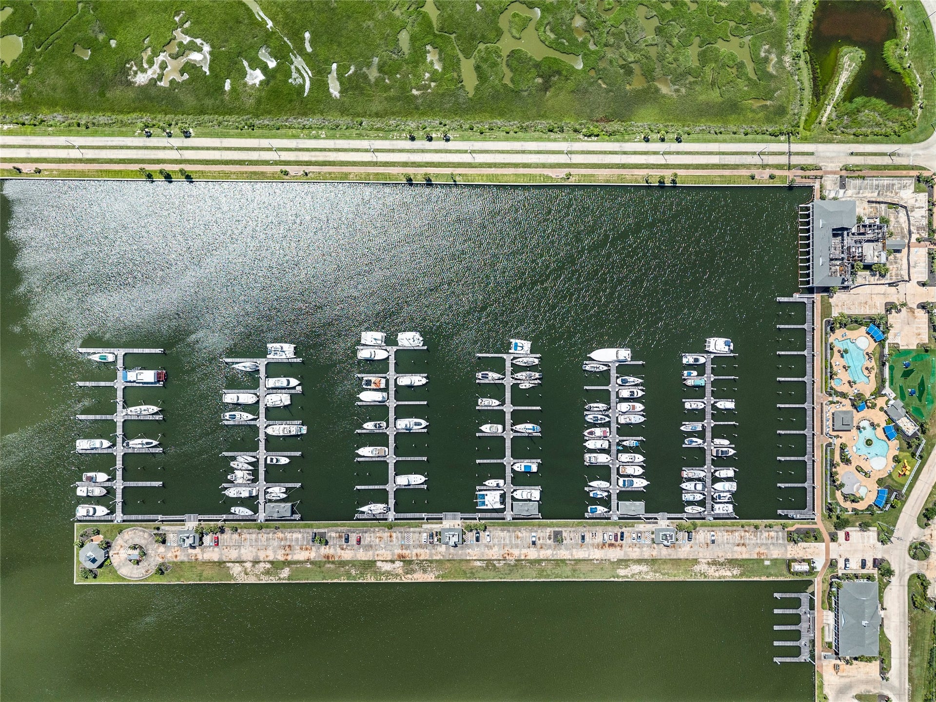 49 Shell Key, Hitchcock, TX 77563 Harborwalk Yacht Club Membership is included with the property for premium marina access.