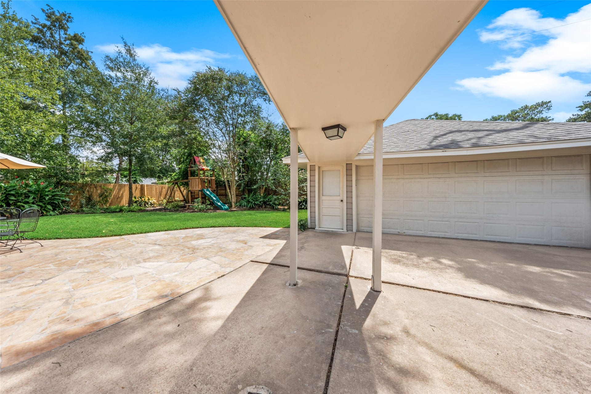 1343 Del Norte Street, Houston, TX 77018 Covered access leads from the home to the detached two-car garage, providing a convenient connection between the house, backyard and garage.