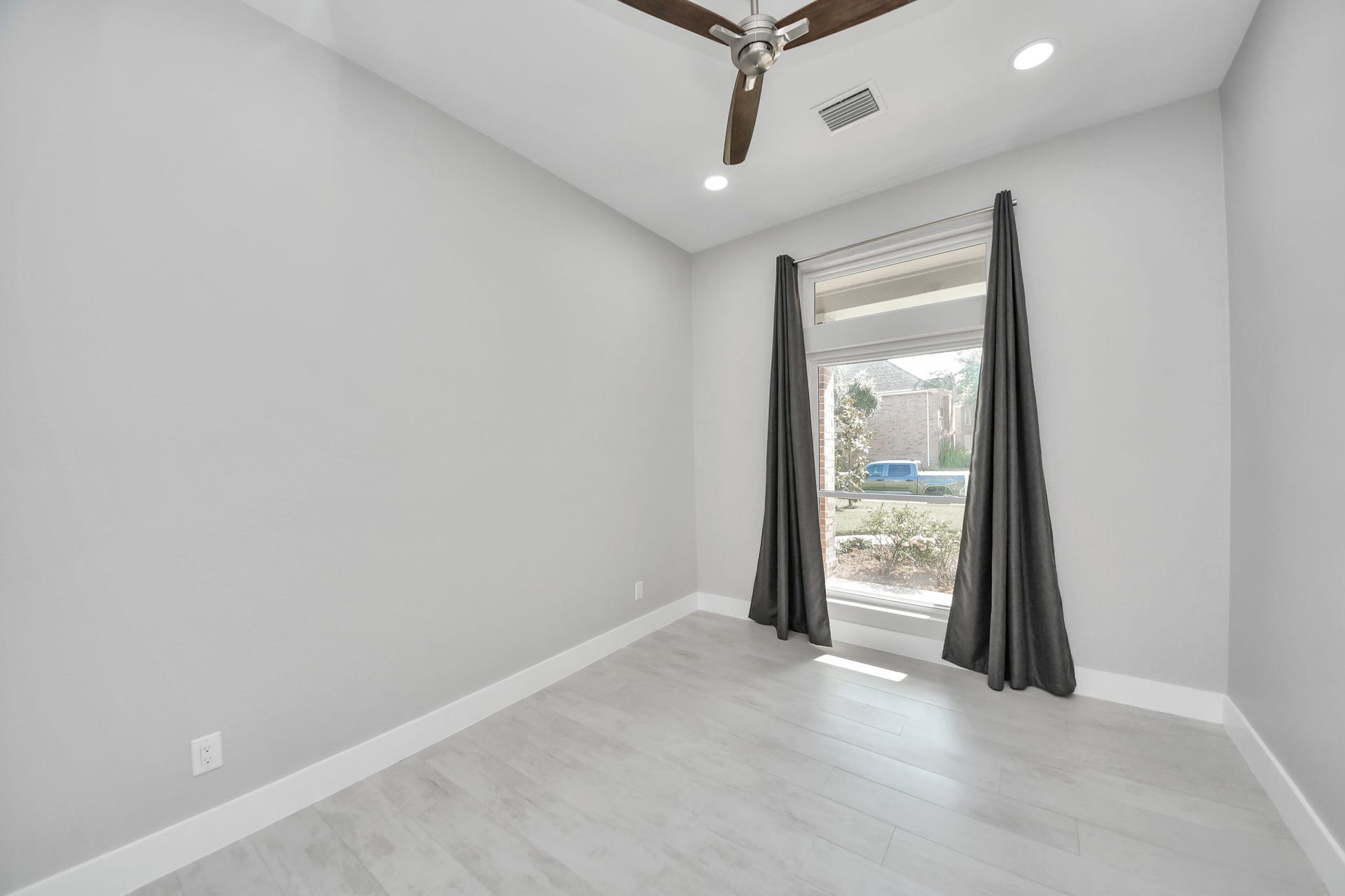 Guest bedroom with updated lights and a upgraded fan