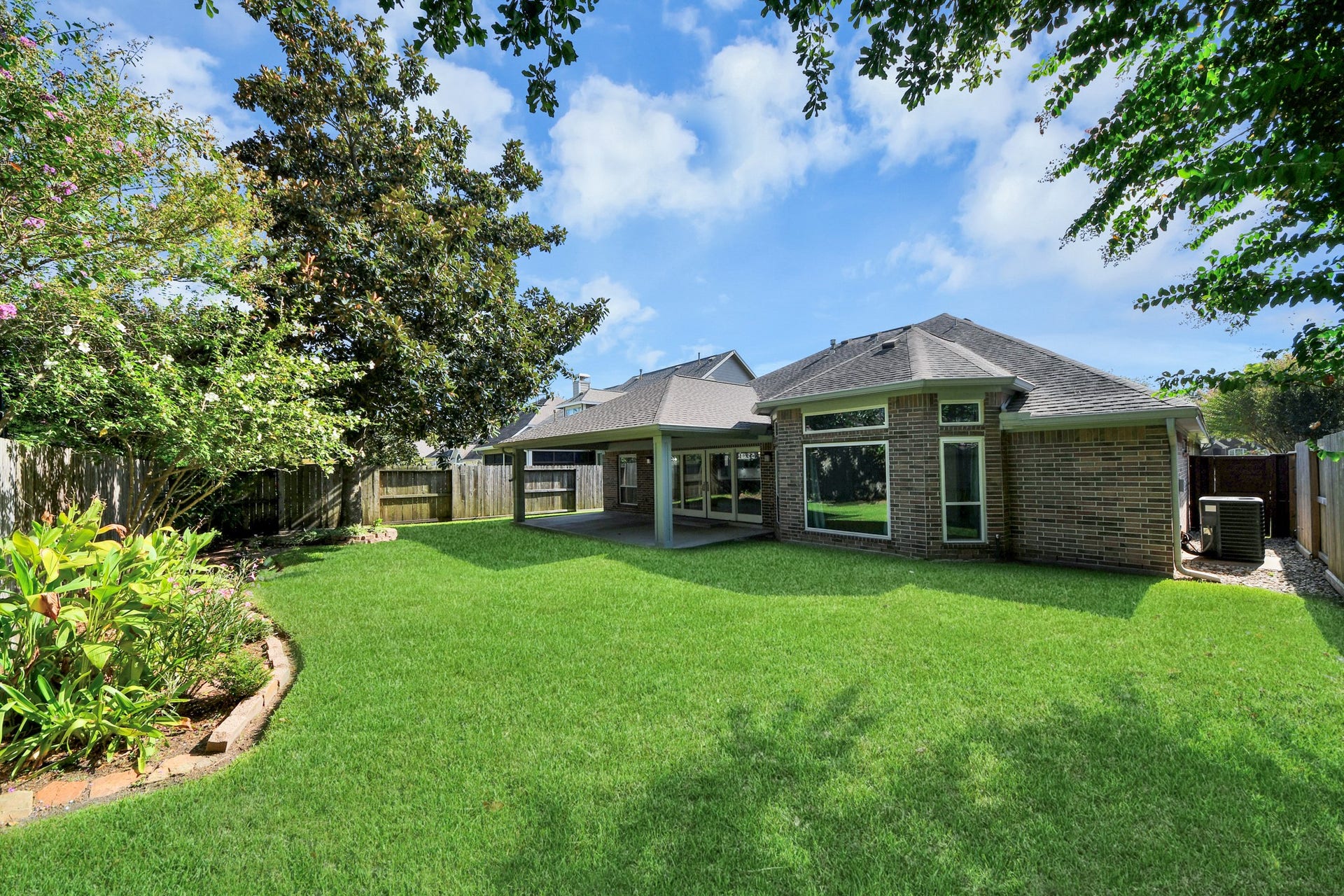 View of the back yard and the back of the home