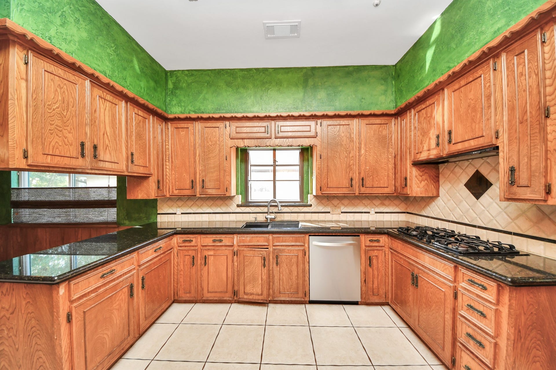 722 Chevy Chase Circle, Sugar Land, TX 77478 The kitchen offers extensive cabinetry, granite counters and a generous footprint ready for a fresh vision.