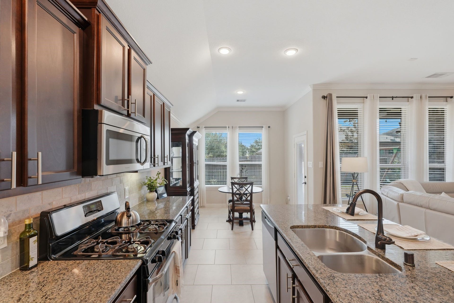 Light and bright kitchen area with a view of your back yard.