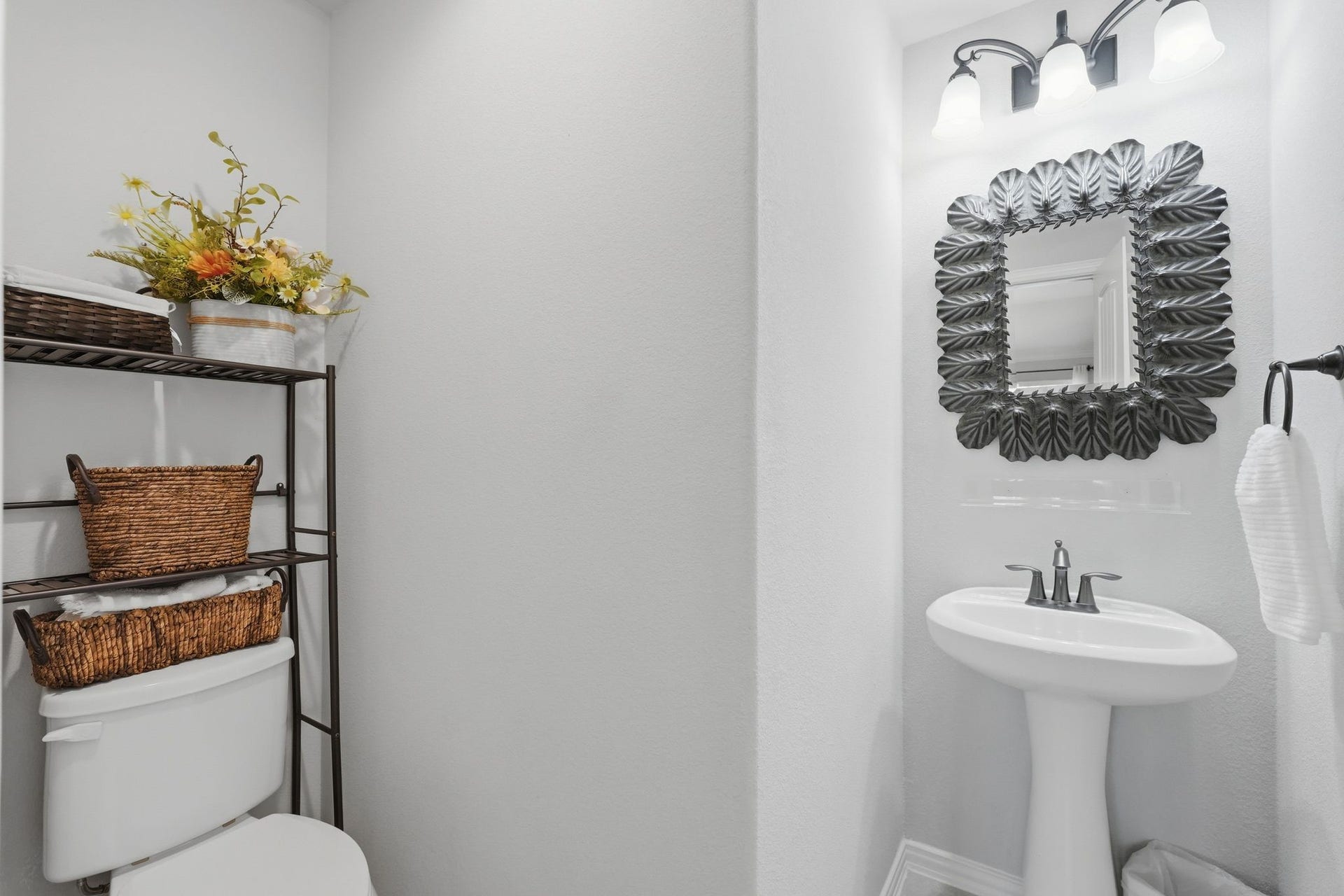 Second half bath is located just at the bottom of the stairs, in the living area.