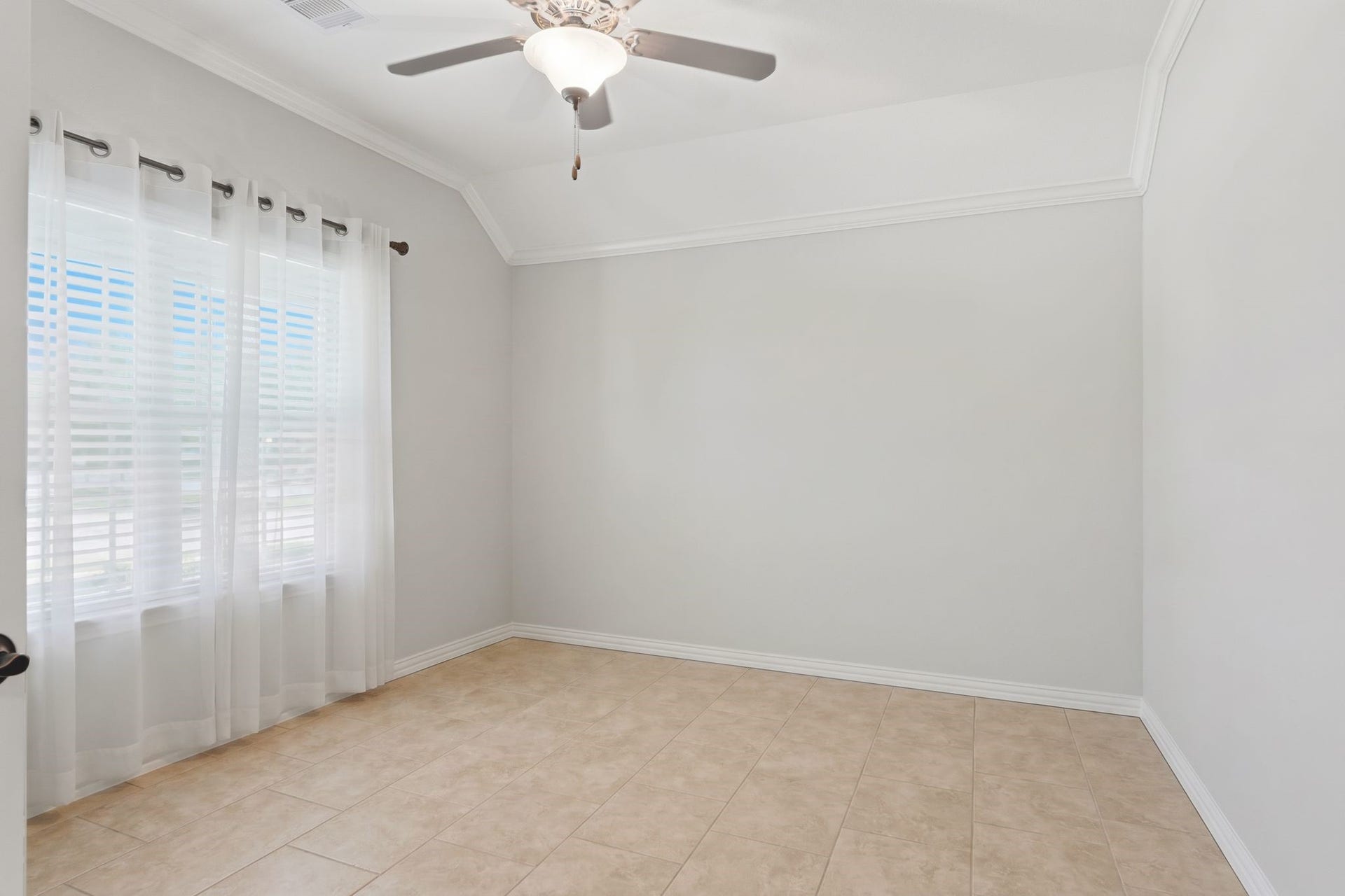 Home Office with crown moulding and a picture window overlooking your expansive corner lot.