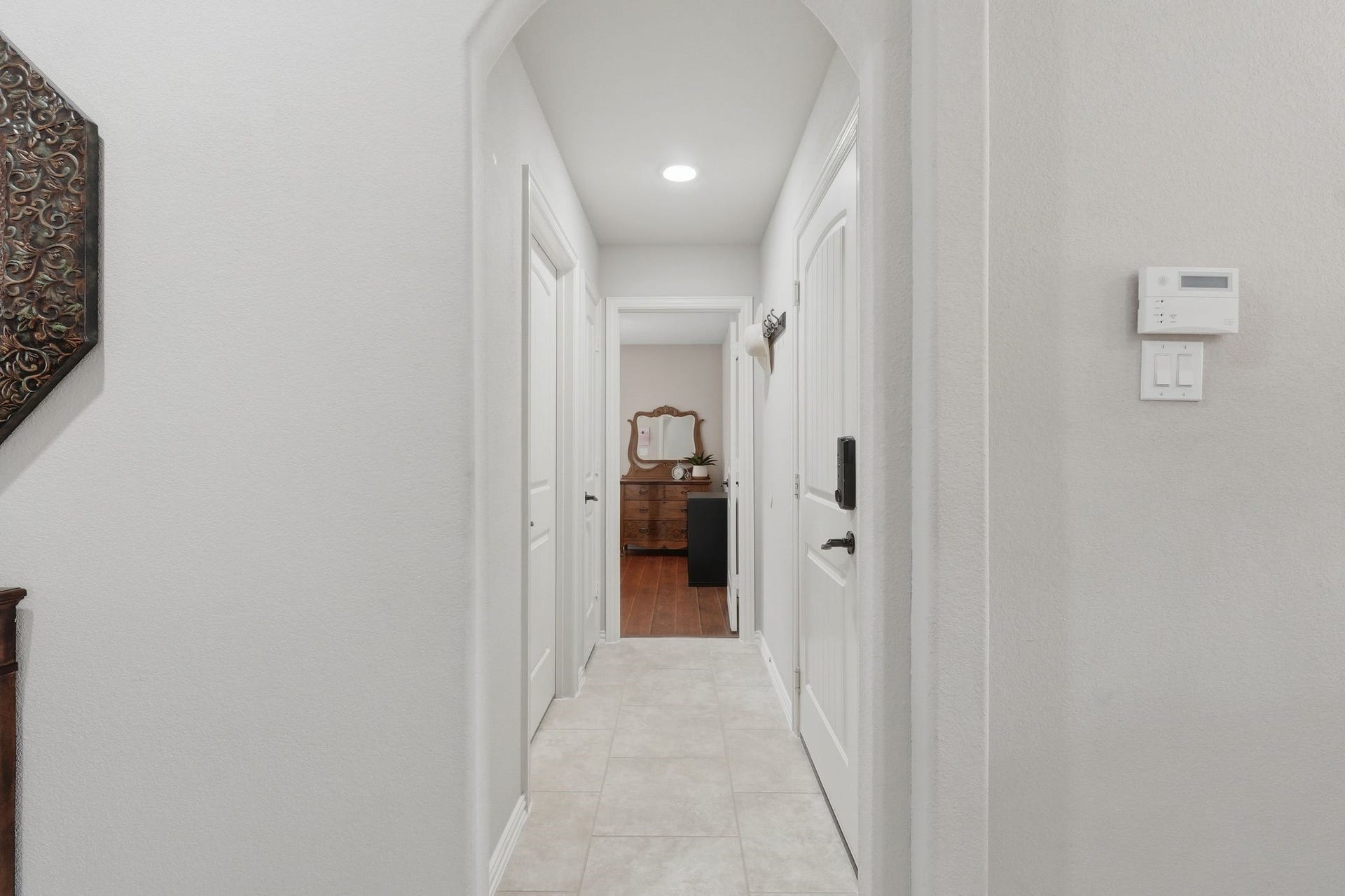 Walk across the entry hall and you will find the laundry and third bedroom.