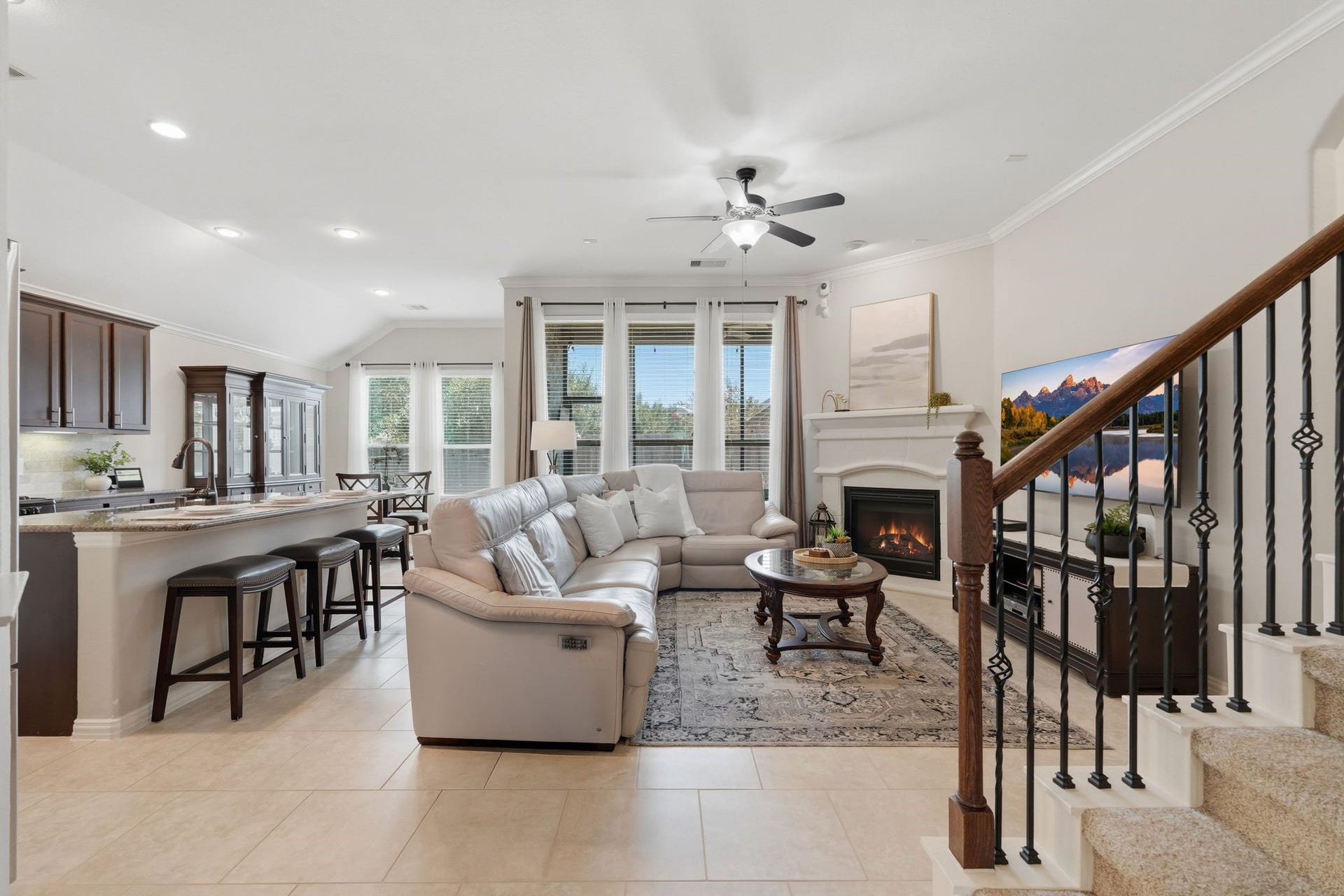 The open concept kitchen and living rooms are designed for entertaining and flow seamlessly from the Formal Dining room.