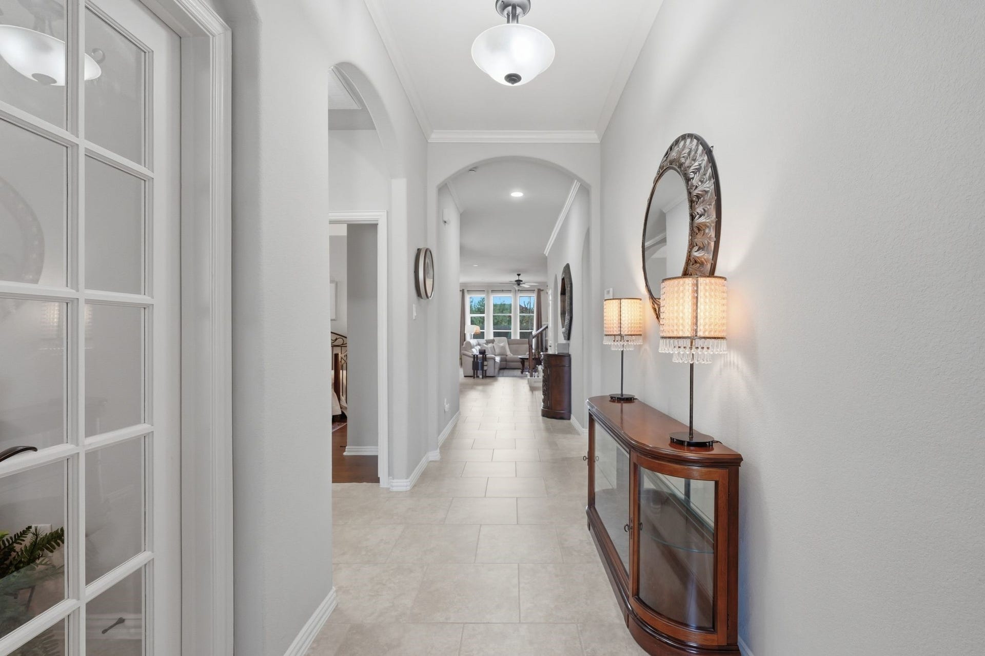 Upon entry you are greeted with a lovely foyer, and the office is to the left through French doors.