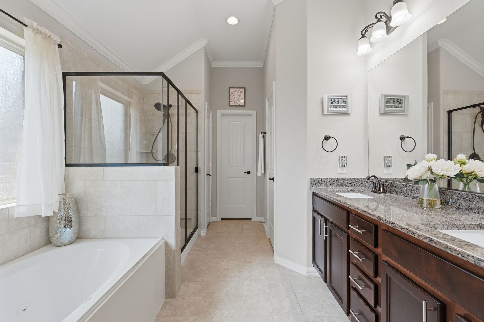 Double vanity, jetted tub, separate shower. This bathroom gets tons of natural light from its southwest facing window.