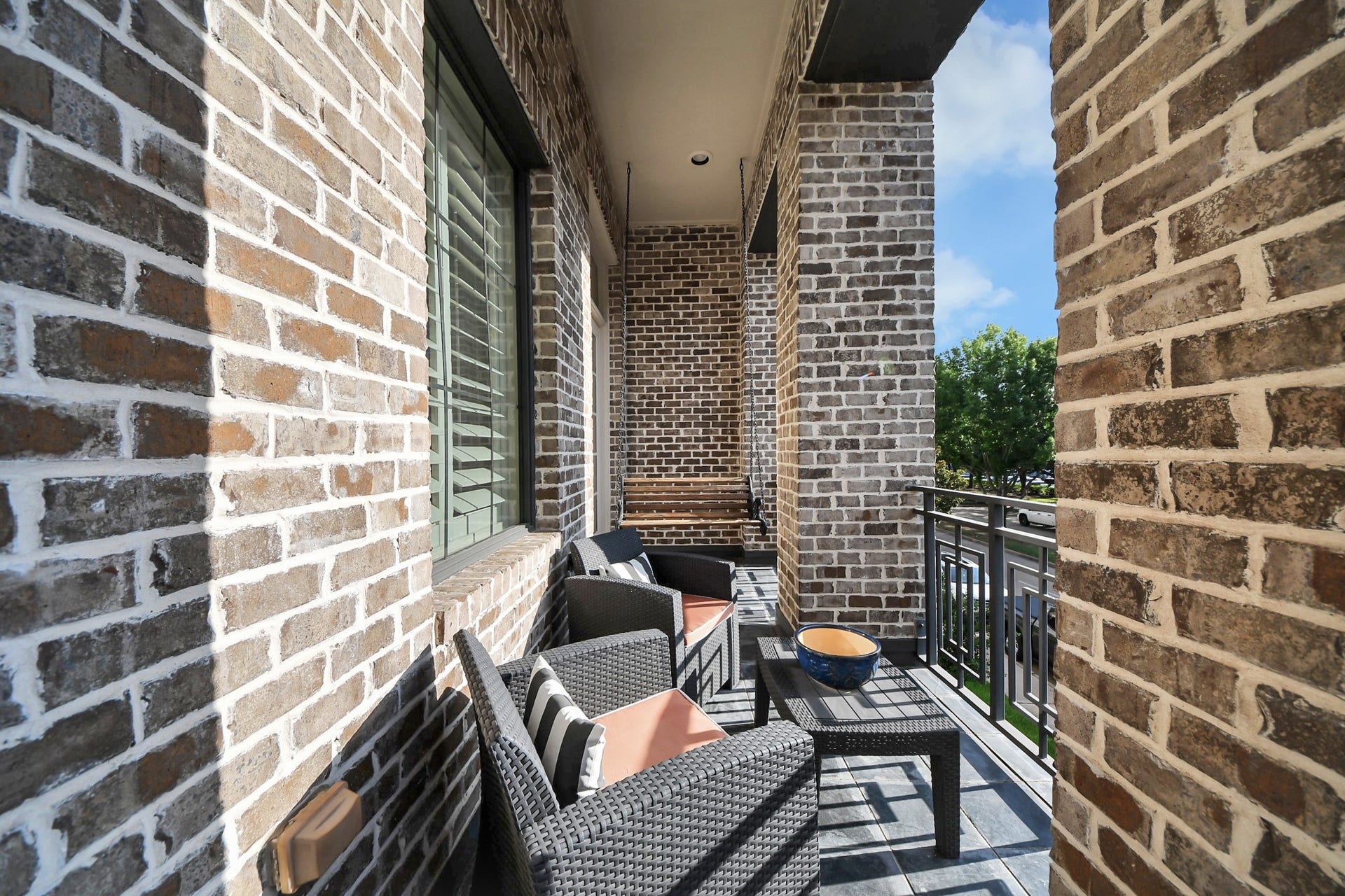 1406 Lake Pointe Parkway, Sugar Land, TX 77478 Overlooking the main boulevard, this spacious covered porch is the perfect place to start your day with coffee or unwind after dinner in the evening shade.