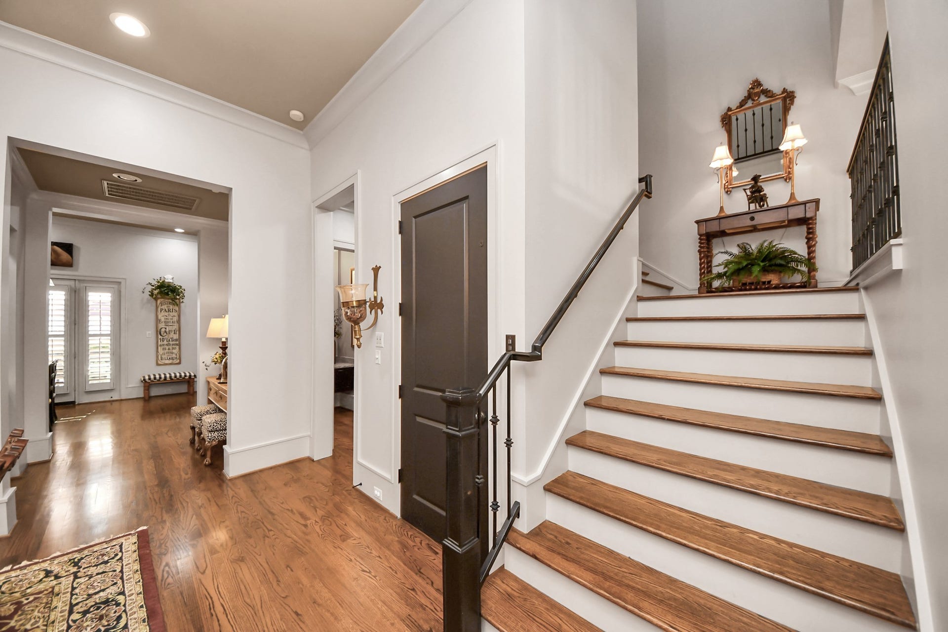 1406 Lake Pointe Parkway, Sugar Land, TX 77478 Stairs leading from second to third floor. Elevator access from the landing seen here (behind the closed door).