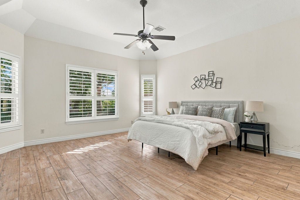 2936 Hawkins Creek Lane, League City, TX 77573 One of the 4 spacious bedrooms, serving as a bright and private retreat.