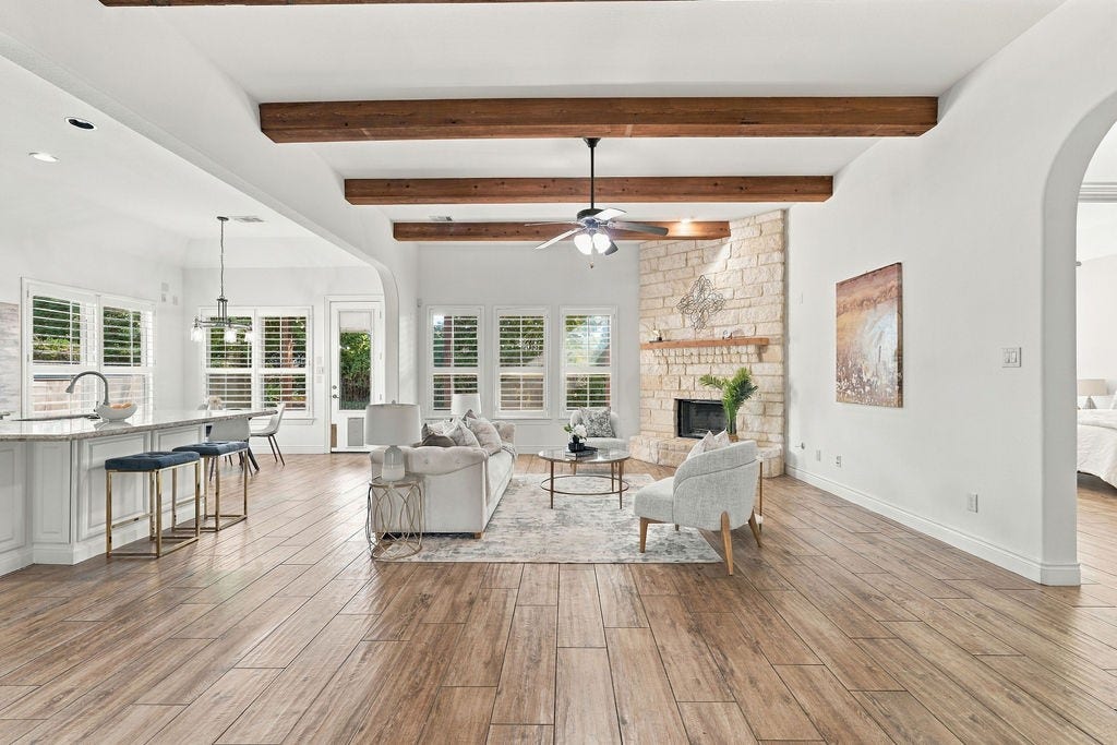 2936 Hawkins Creek Lane, League City, TX 77573 The open living area features gorgeous wood-beam ceilings and tons of natural light.