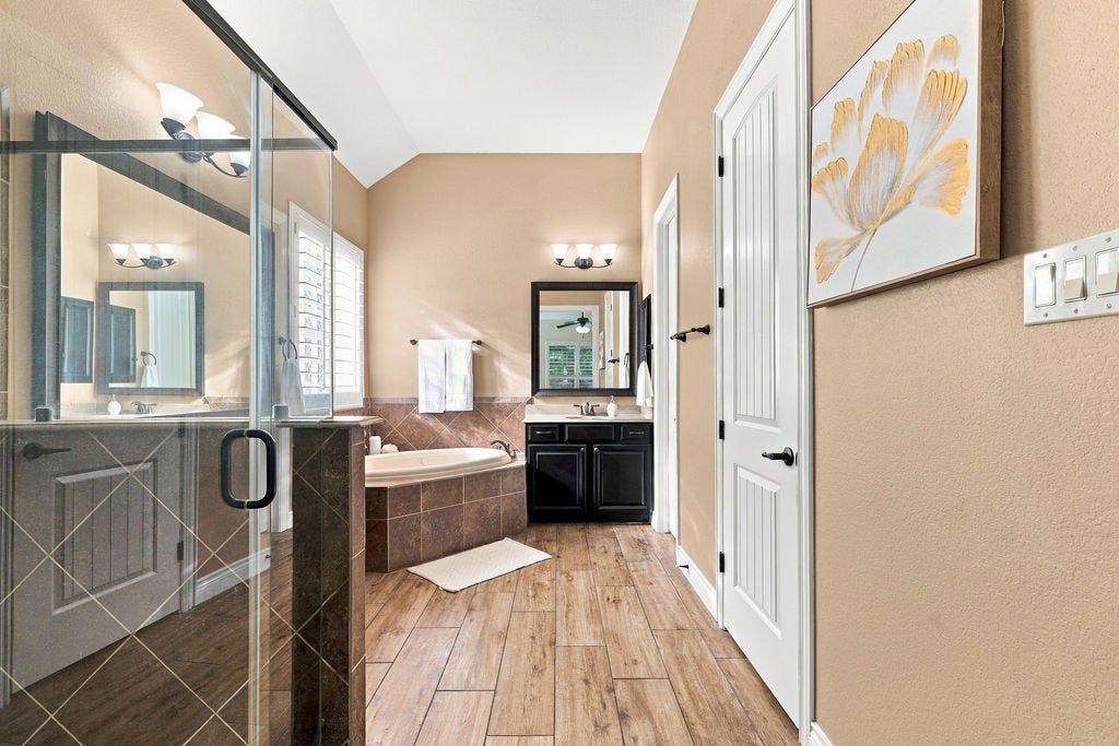 2936 Hawkins Creek Lane, League City, TX 77573 Spa-like primary bathroom with a long double vanity and great storage.