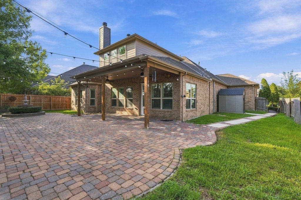 2936 Hawkins Creek Lane, League City, TX 77573 This massive covered patio layout acts as a second outdoor living room.
