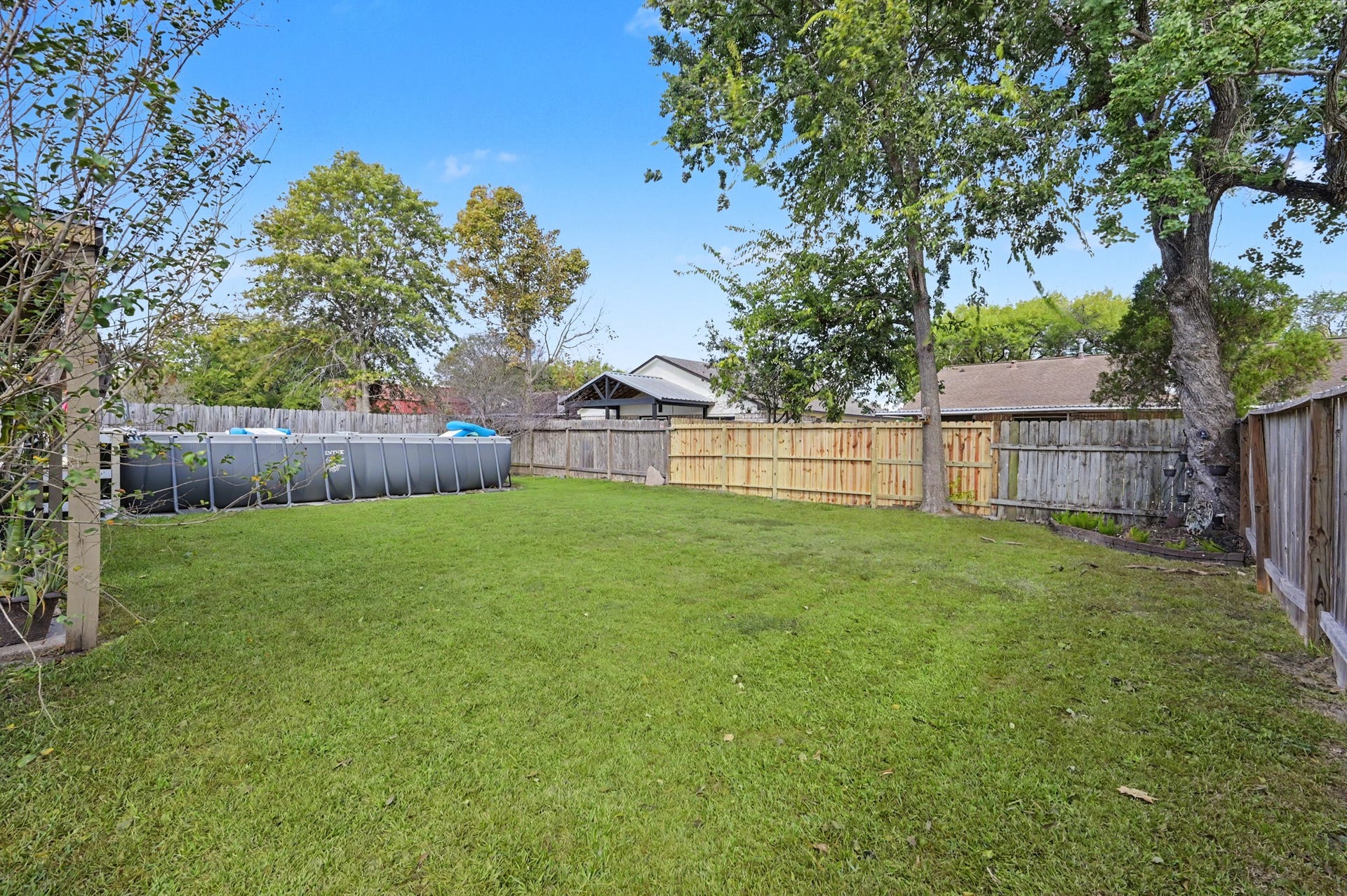 1115 Thomas Drive, Humble, TX 77338 Spacious backyard perfect for outdoor relaxation and entertaining.