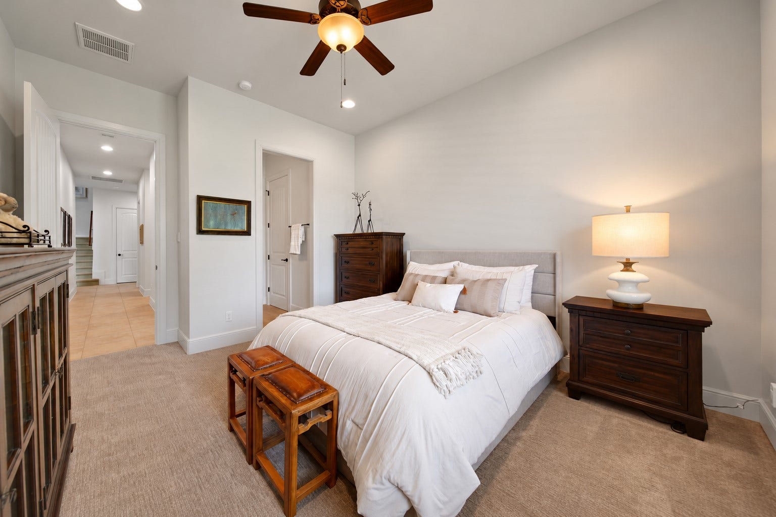 A third first-floor bedroom offers a welcoming place to begin and end the day. Its private entrance to the bathroom adds everyday convenience.
