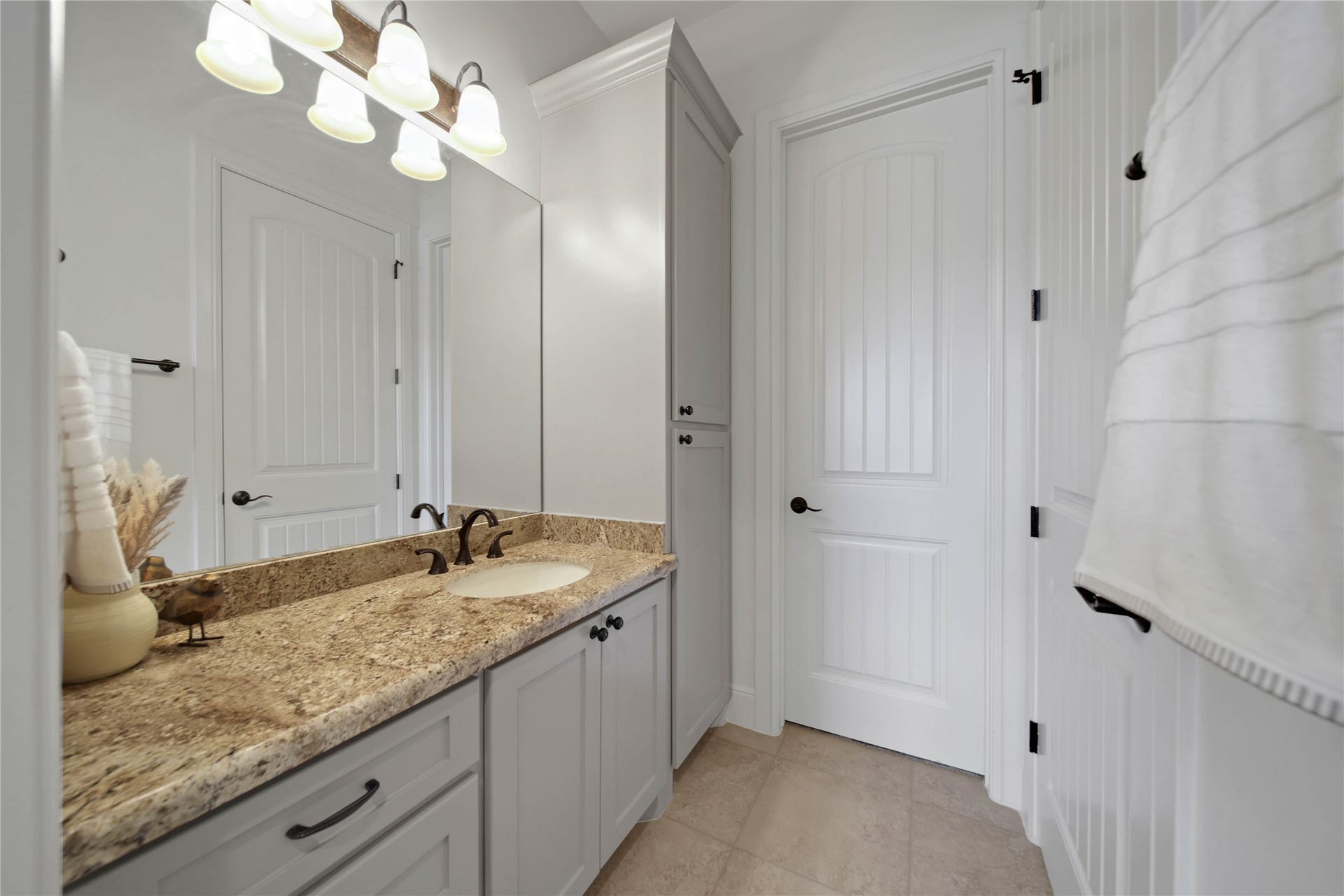 Ample counter space and drawer and cabinet storage keep everyday essentials organized. Each bedroom enjoys its own dedicated sink.