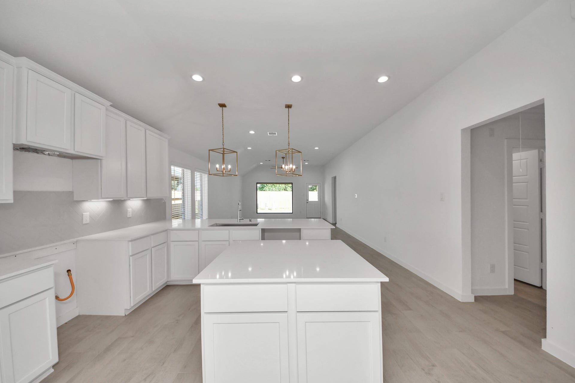 11015 Hosta Stream Drive, Houston, TX 77044 The extended counter area adds both practicality and style, making meal preparation a breeze. Every detail is thoughtfully designed to enhance the kitchen's functionality and aesthetic appeal. Sample photo of completed home with similar floor plan. Actual colors and selections may vary.