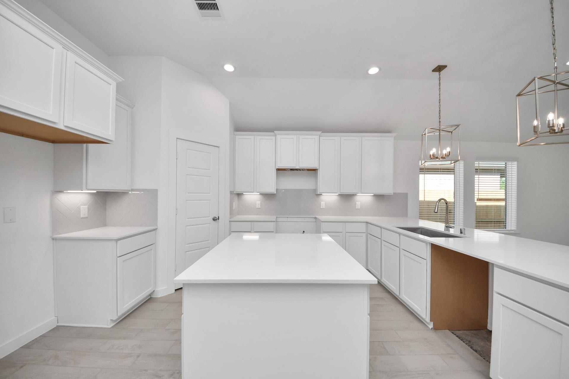 11015 Hosta Stream Drive, Houston, TX 77044 This kitchen is by far any chefs dream! This spacious kitchen features high ceilings, light stained wood cabinets, granite countertop, SS appliances, modern tile backsplash, recessed lighting, extended counter space, granite kitchen island, and space for breakfast bar, and a walk-in pantry all overlooking your huge family room. Sample photo of completed home with similar floor plan. Actual colors and selections may vary.