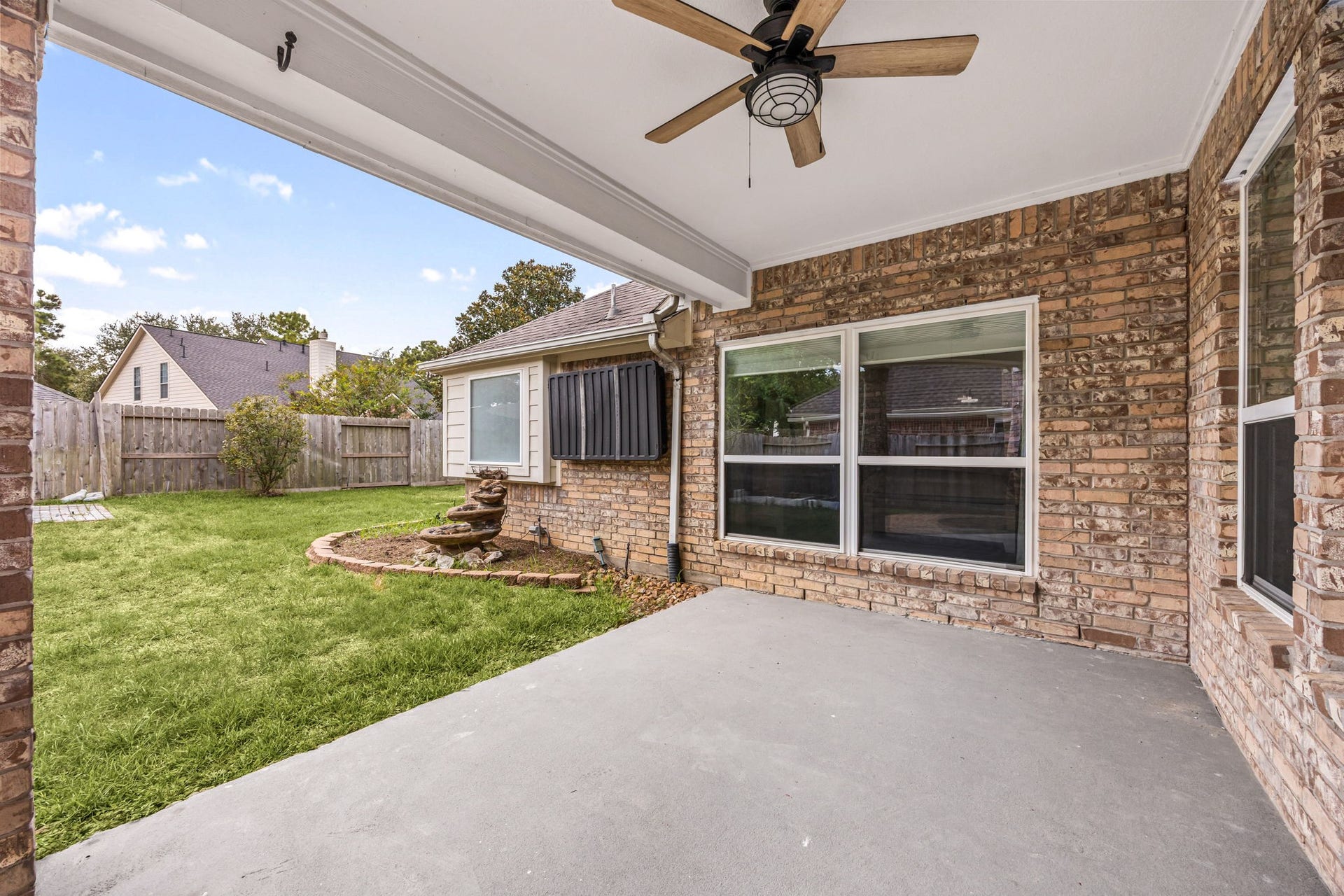 4730 Camden Brook Lane, Katy, TX 77494 Additional covered patio view overlooking the backyard and providing a shaded space for outdoor relaxation.