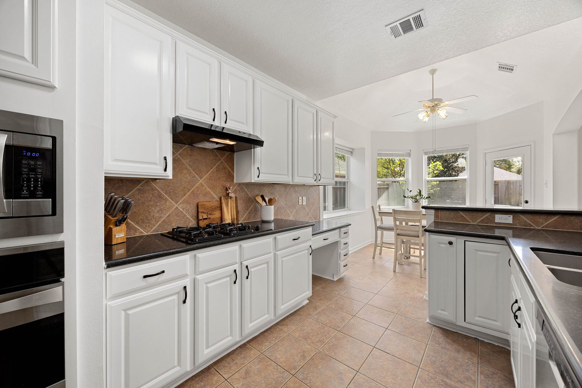 4730 Camden Brook Lane, Katy, TX 77494 Additional kitchen view showcasing the generous workspace, abundant storage, and open connection to the breakfast area.