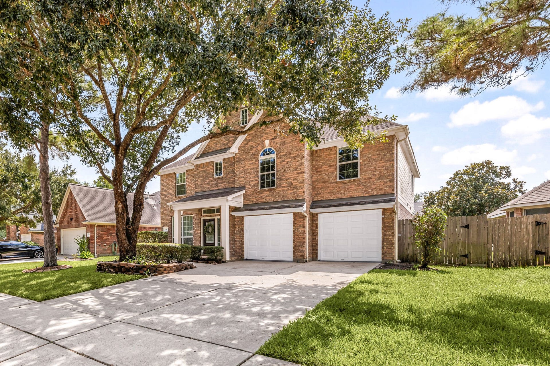 4730 Camden Brook Lane, Katy, TX 77494 Additional front exterior view showcasing the homes two-story design, shaded front lawn, and covered entry.