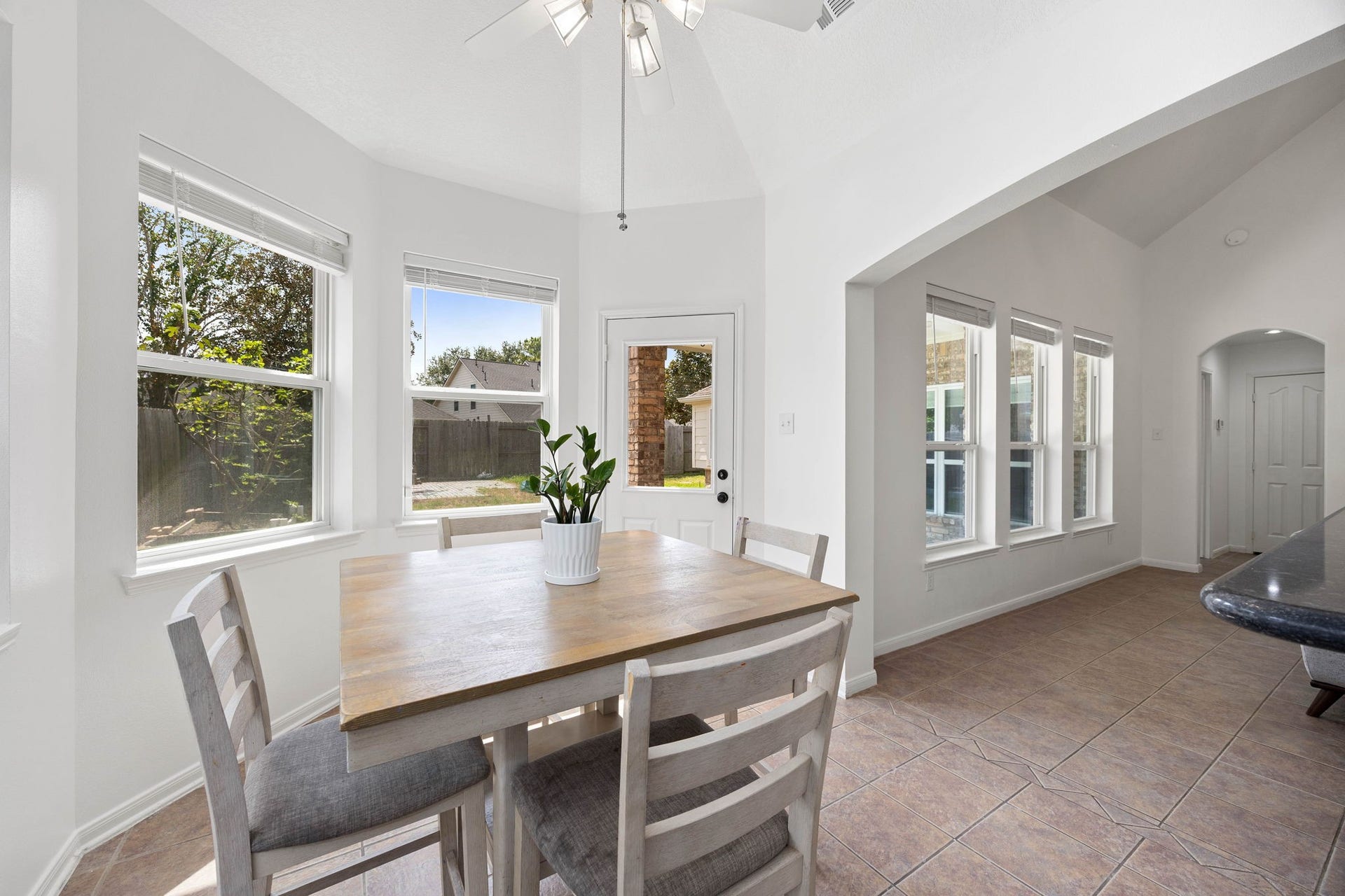 4730 Camden Brook Lane, Katy, TX 77494 Bright breakfast area surrounded by windows and conveniently positioned between the kitchen and living space.