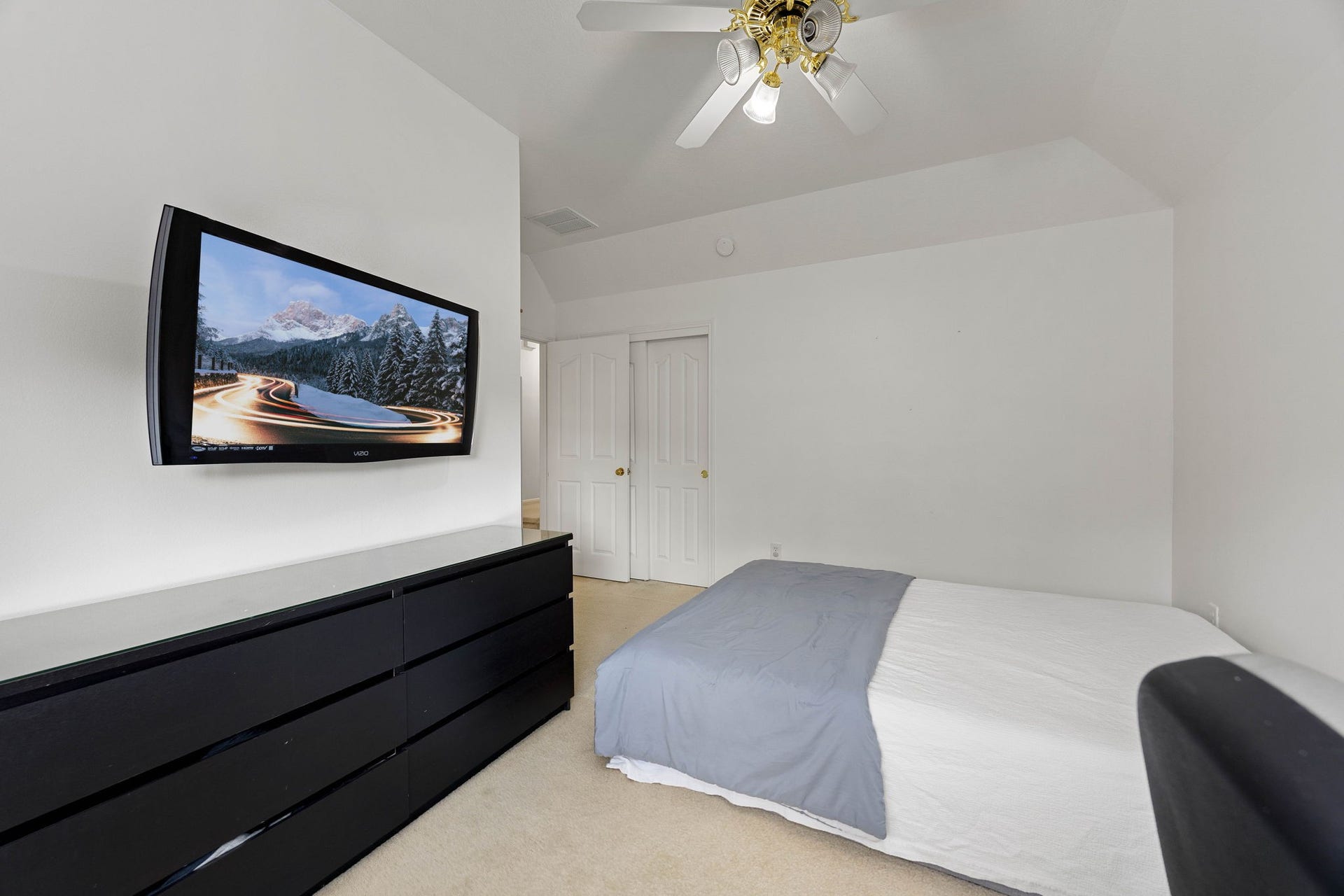 4730 Camden Brook Lane, Katy, TX 77494 Secondary bedroom offering natural light, a ceiling fan, and flexible space for family members or guests.