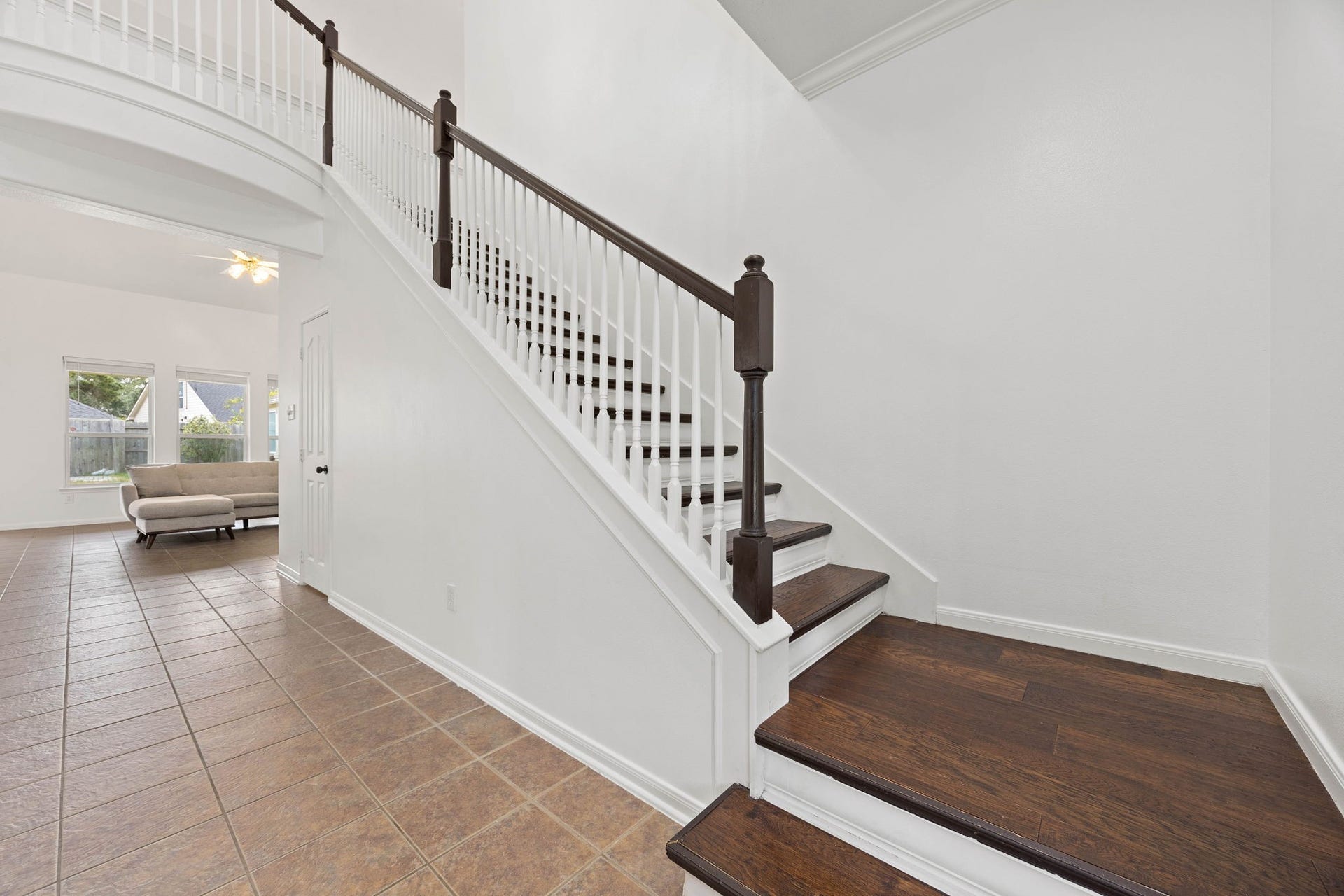 4730 Camden Brook Lane, Katy, TX 77494 Upstairs landing and staircase featuring an open railing and a view toward the main level of the home.
