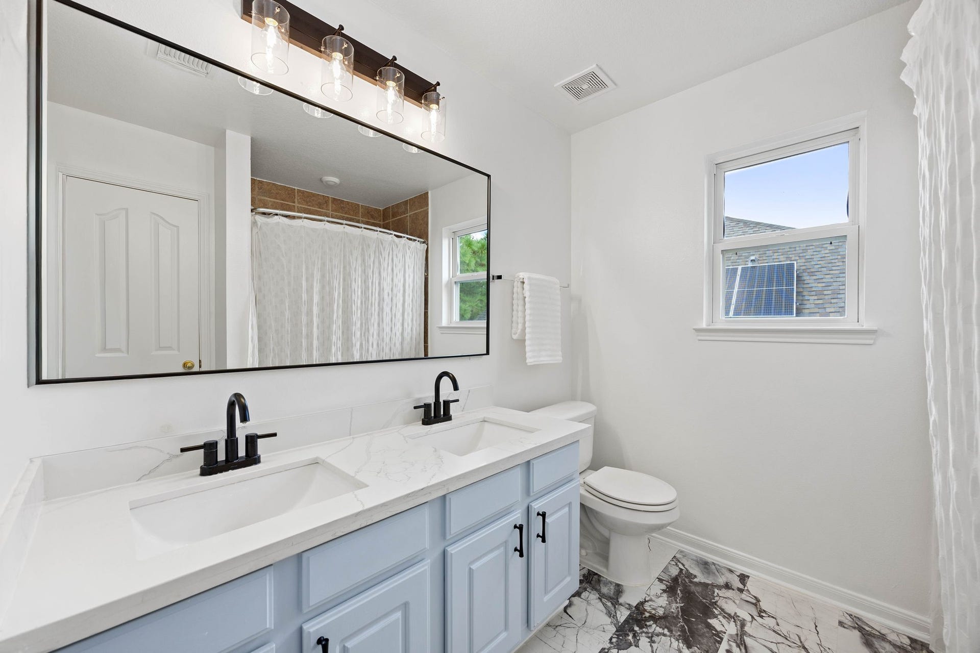 4730 Camden Brook Lane, Katy, TX 77494 Secondary full bathroom featuring a spacious vanity, cabinet storage, and a tub-and-shower combination.