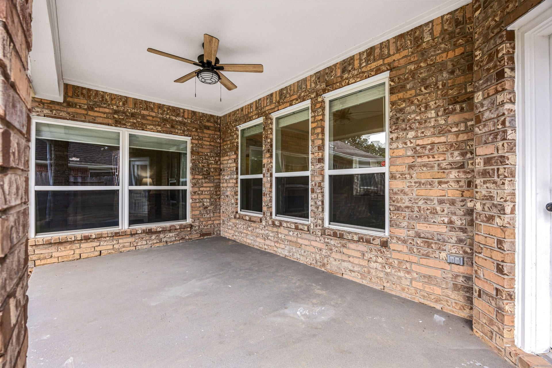 4730 Camden Brook Lane, Katy, TX 77494 Covered back patio featuring a ceiling fan and generous space for outdoor seating and entertaining.