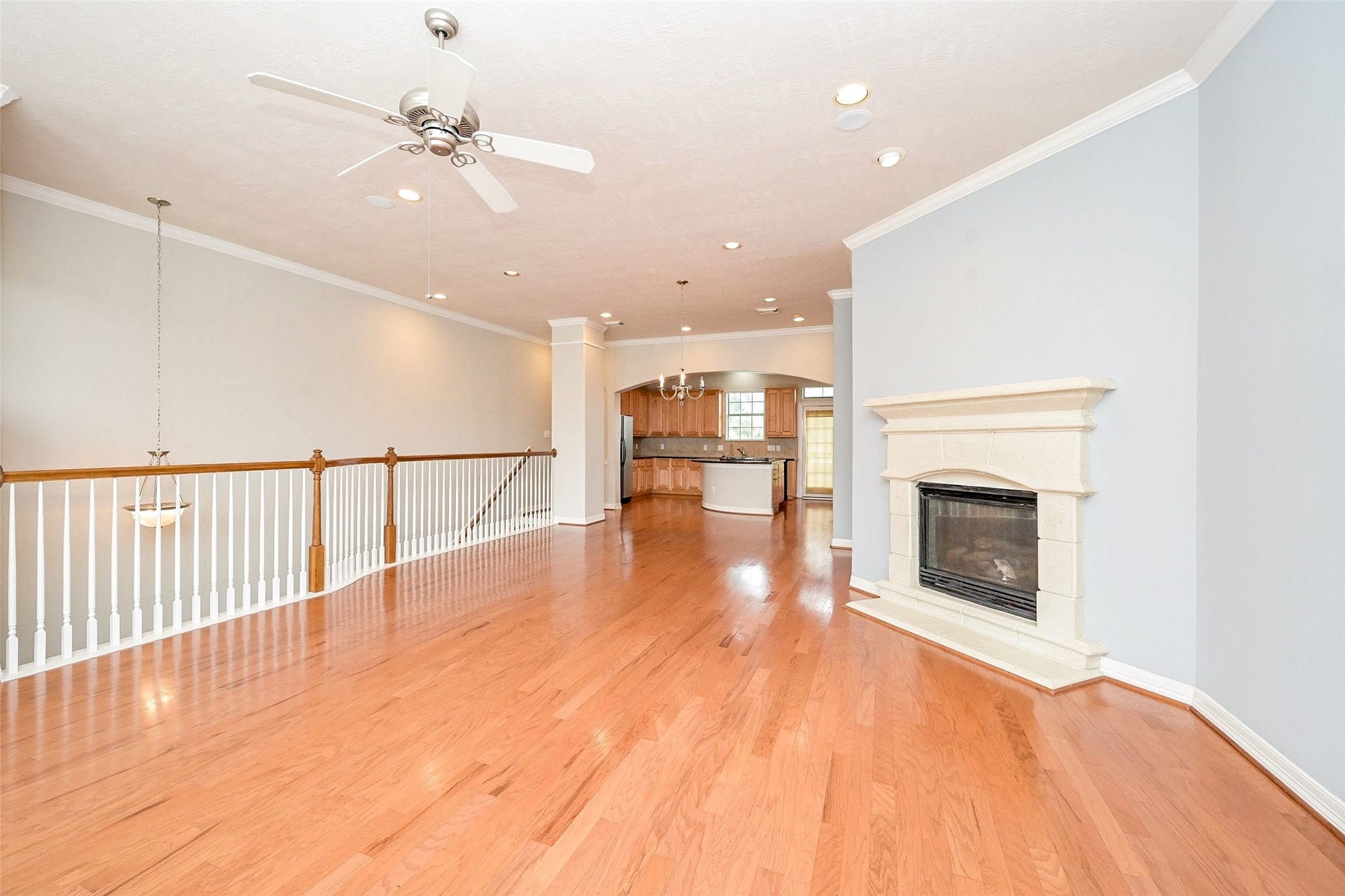 7933 Telluride Drive, Houston, TX 77040 Spacious and Open Floor Plan with a Fireplace, featuring original hardwood flooring.