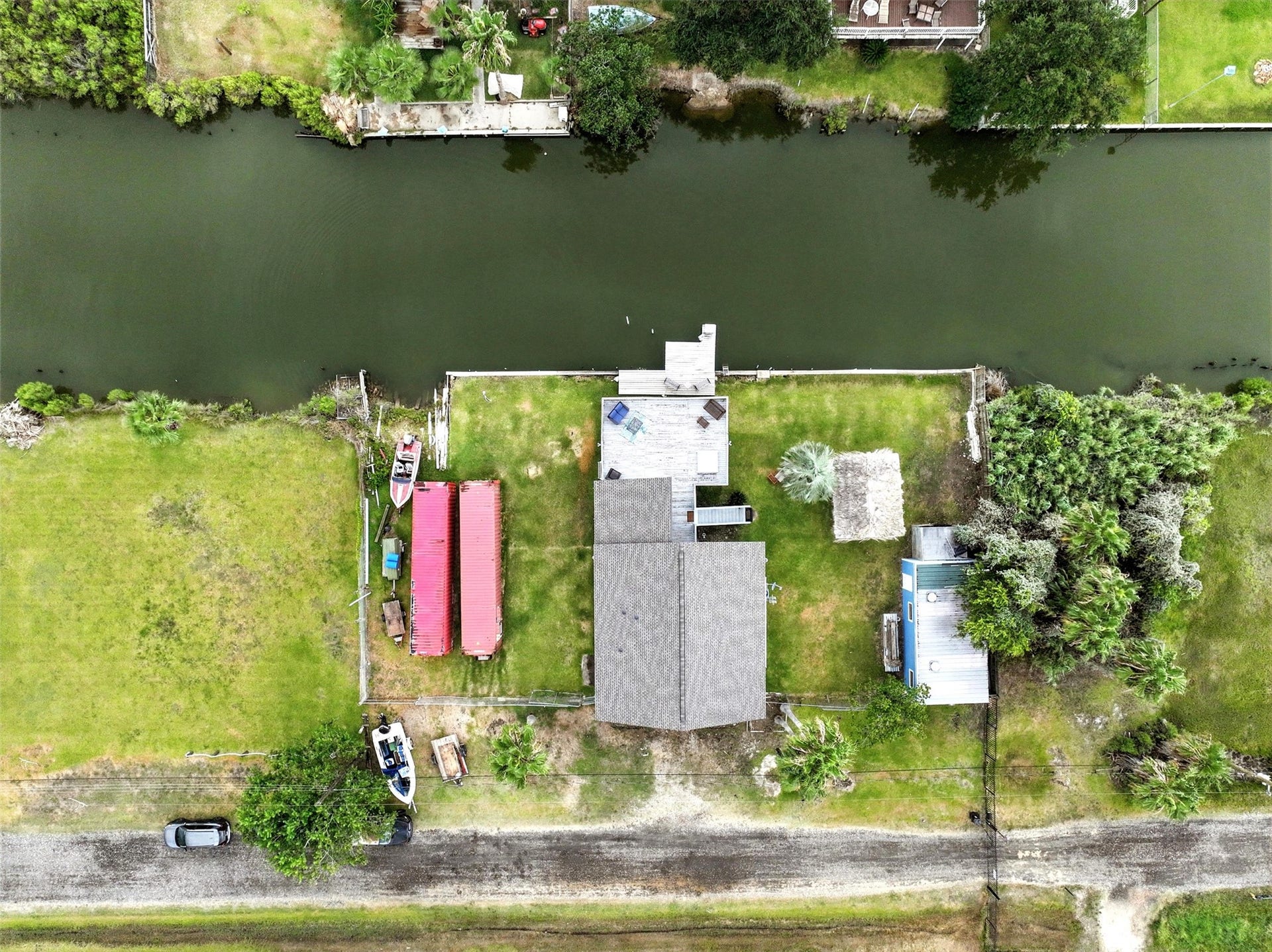 7215 Beau Rue Street, Hitchcock, TX 77563 aerial view of 3 lots with waterfront footage