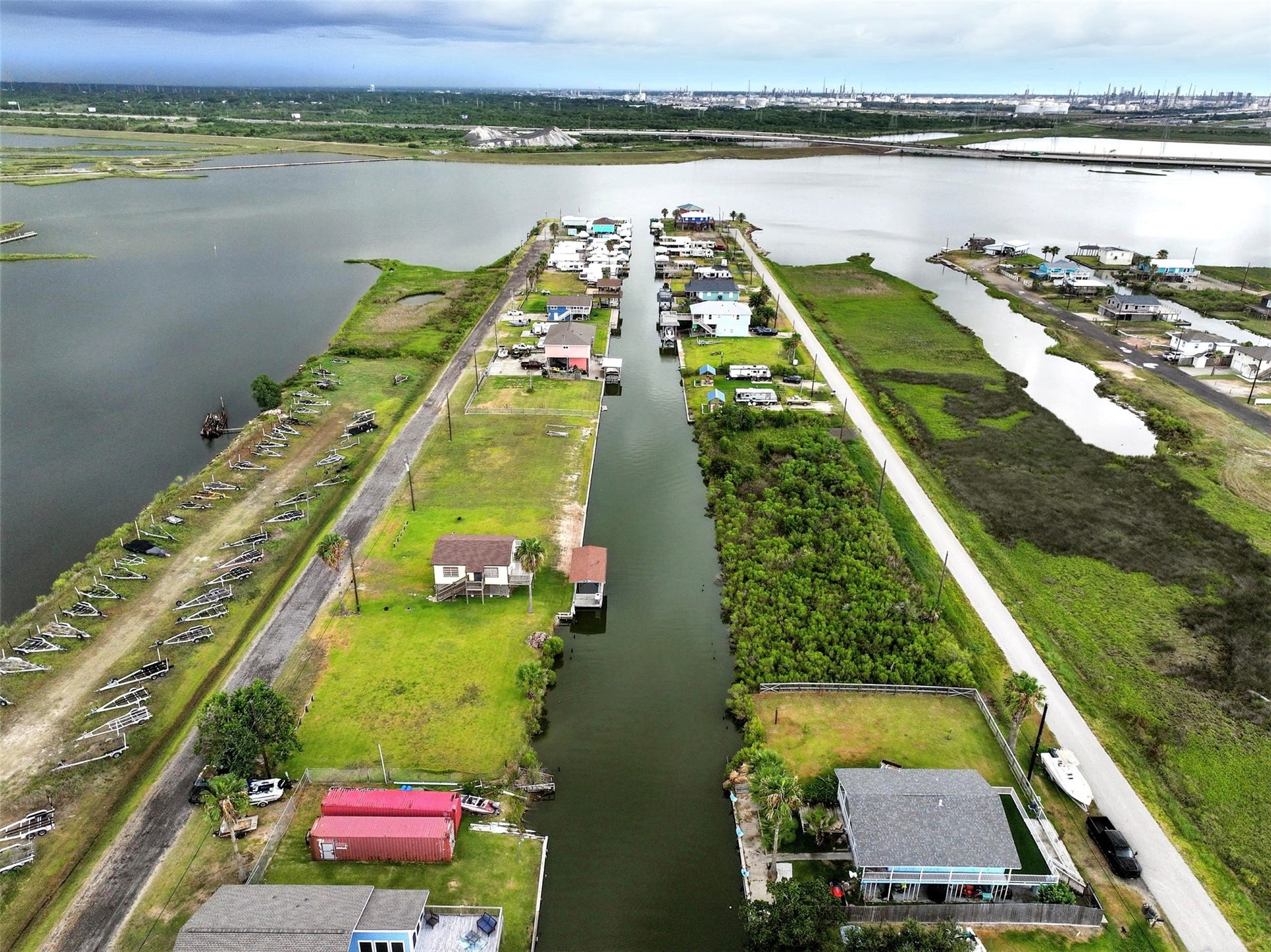 7215 Beau Rue Street, Hitchcock, TX 77563 aeiral view showing the canal that leads to the larger water connected to the bay