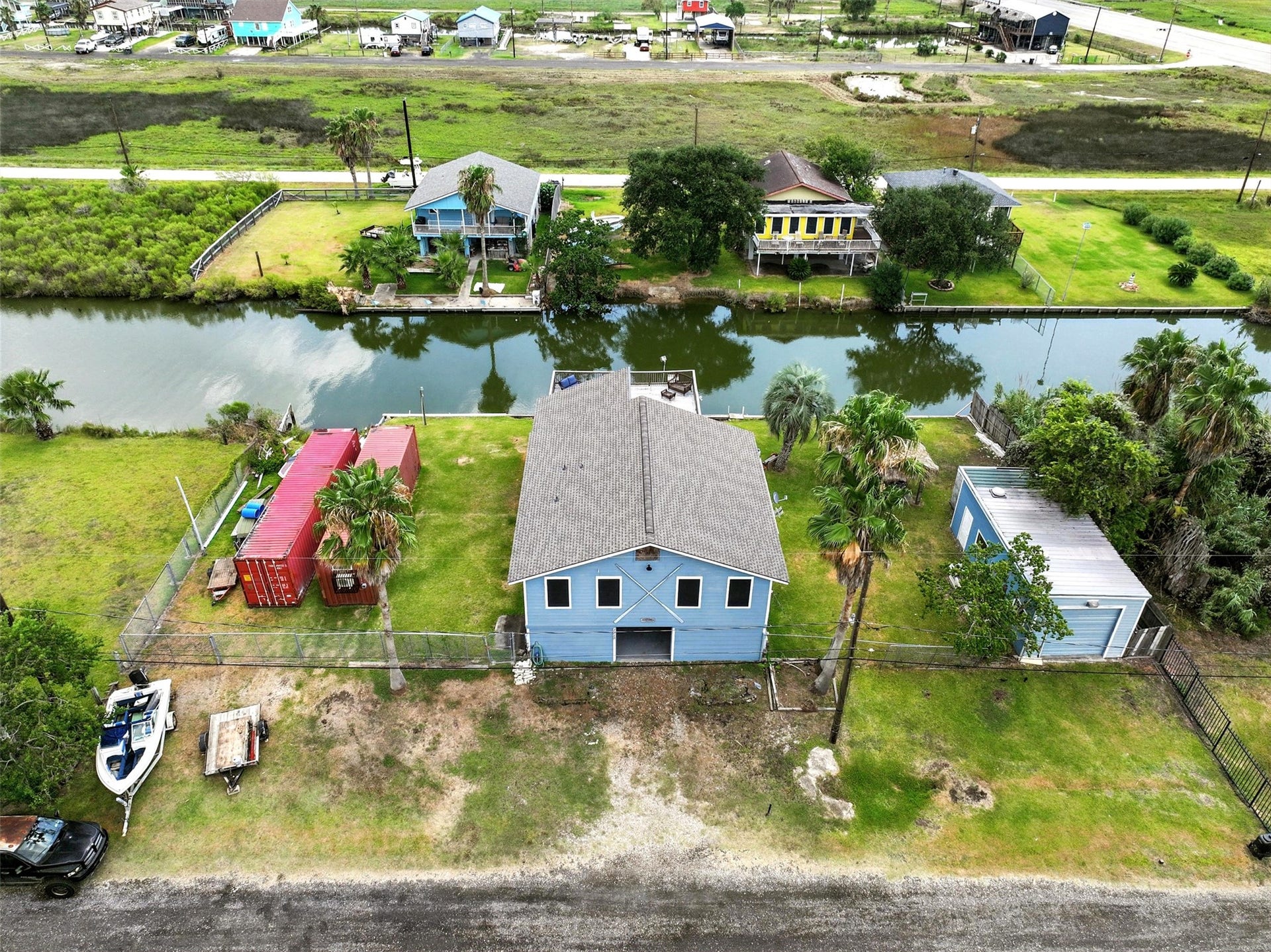 7215 Beau Rue Street, Hitchcock, TX 77563 aearial view of front of home with canal in back