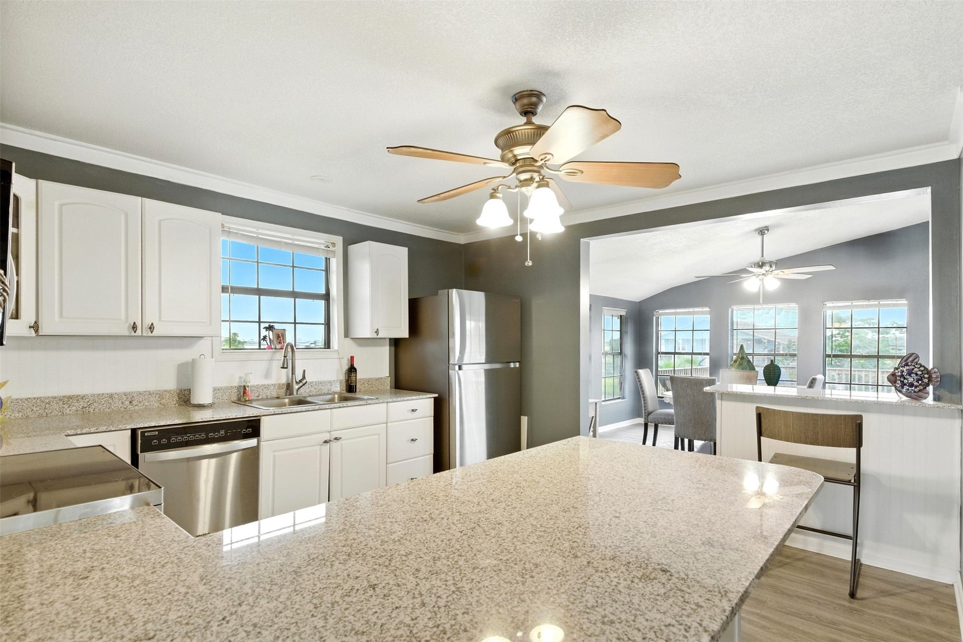 7215 Beau Rue Street, Hitchcock, TX 77563 Kitchen leads to dining room with waterviews from three sides