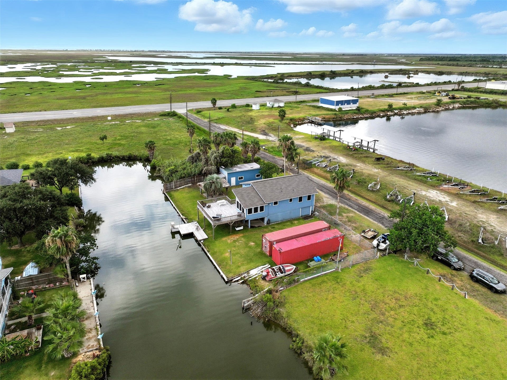 7215 Beau Rue Street, Hitchcock, TX 77563 canal ends right beyond property line for a private swimming hole
