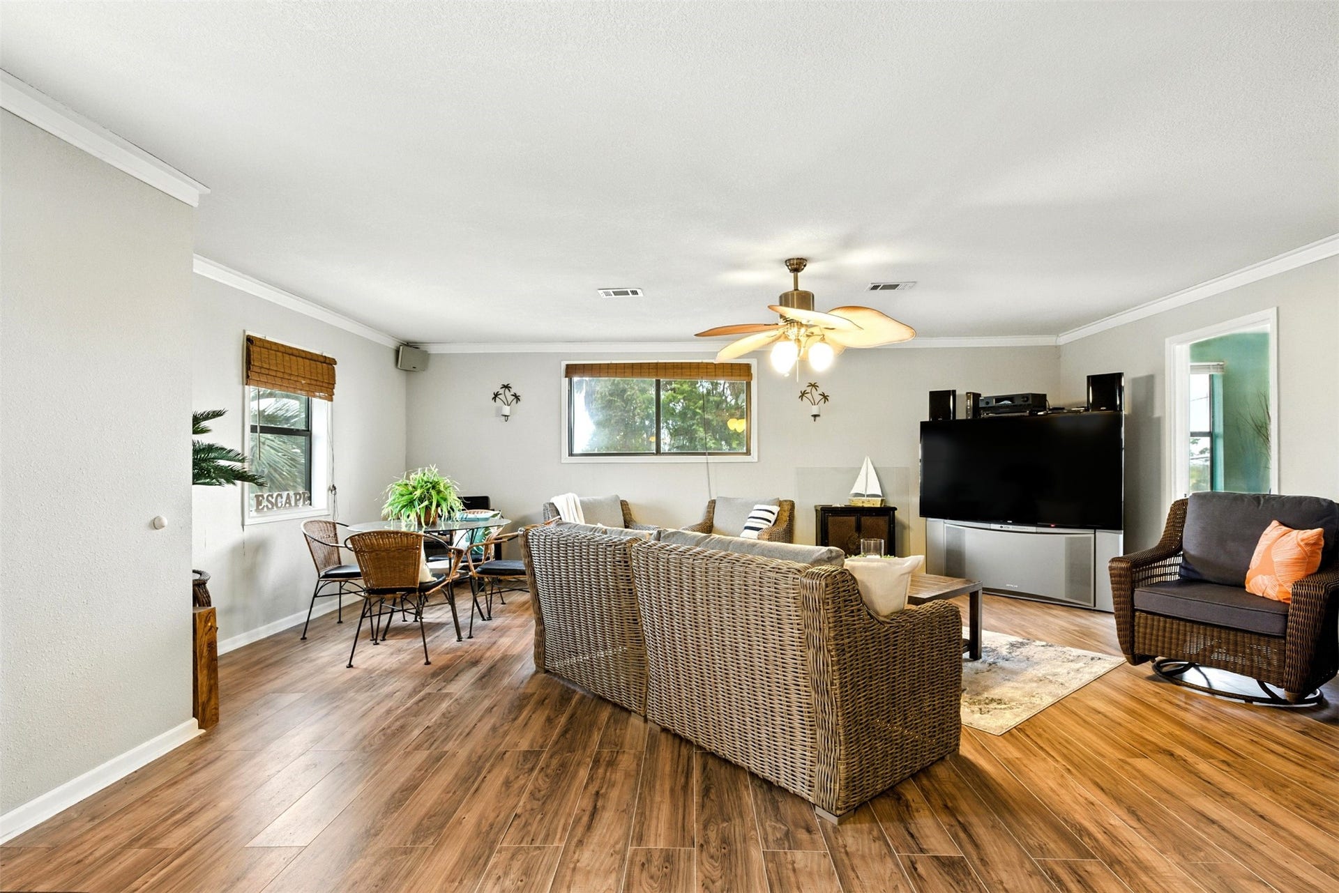 7215 Beau Rue Street, Hitchcock, TX 77563 family room with beautiful luxury vinyl plank flooring that is waterproof