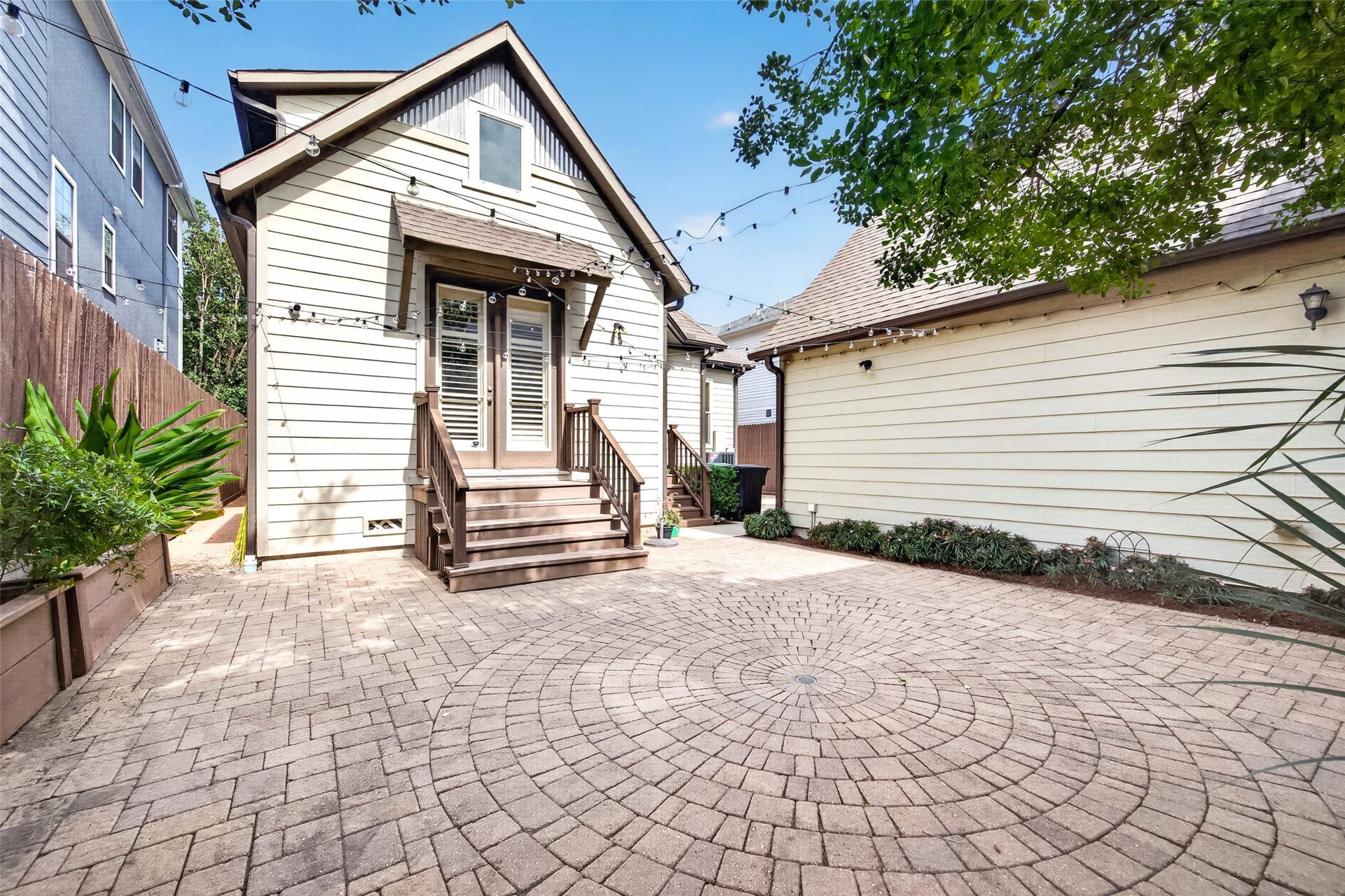 1207 Welch Street, Houston, TX 77006 The detached garage at the rear of the property provides convenient parking while adding an extra layer of privacy to the backyard.