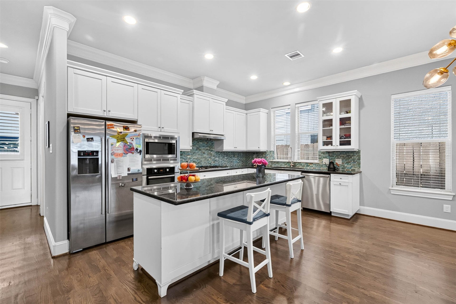 1207 Welch Street, Houston, TX 77006 The kitchen's location at the rear of the home makes entertaining a breeze, with easy access to the backyard for dining and gathering with friends and family.