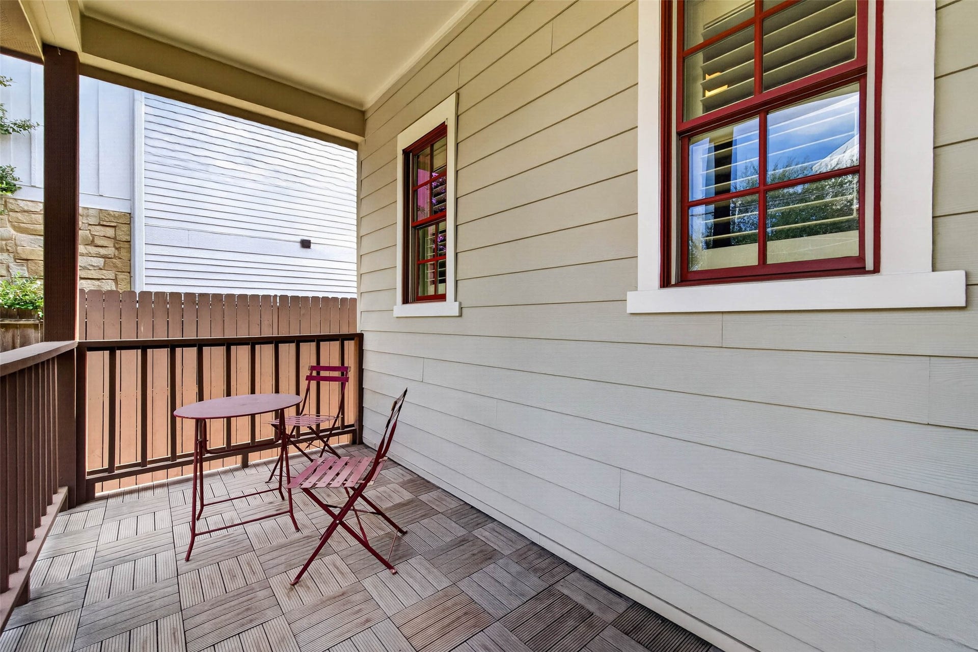 1207 Welch Street, Houston, TX 77006 A closer look at this spacious front porch, showcasing the inviting sitting area and charming details that make this home feel so welcoming from the moment you arrive.