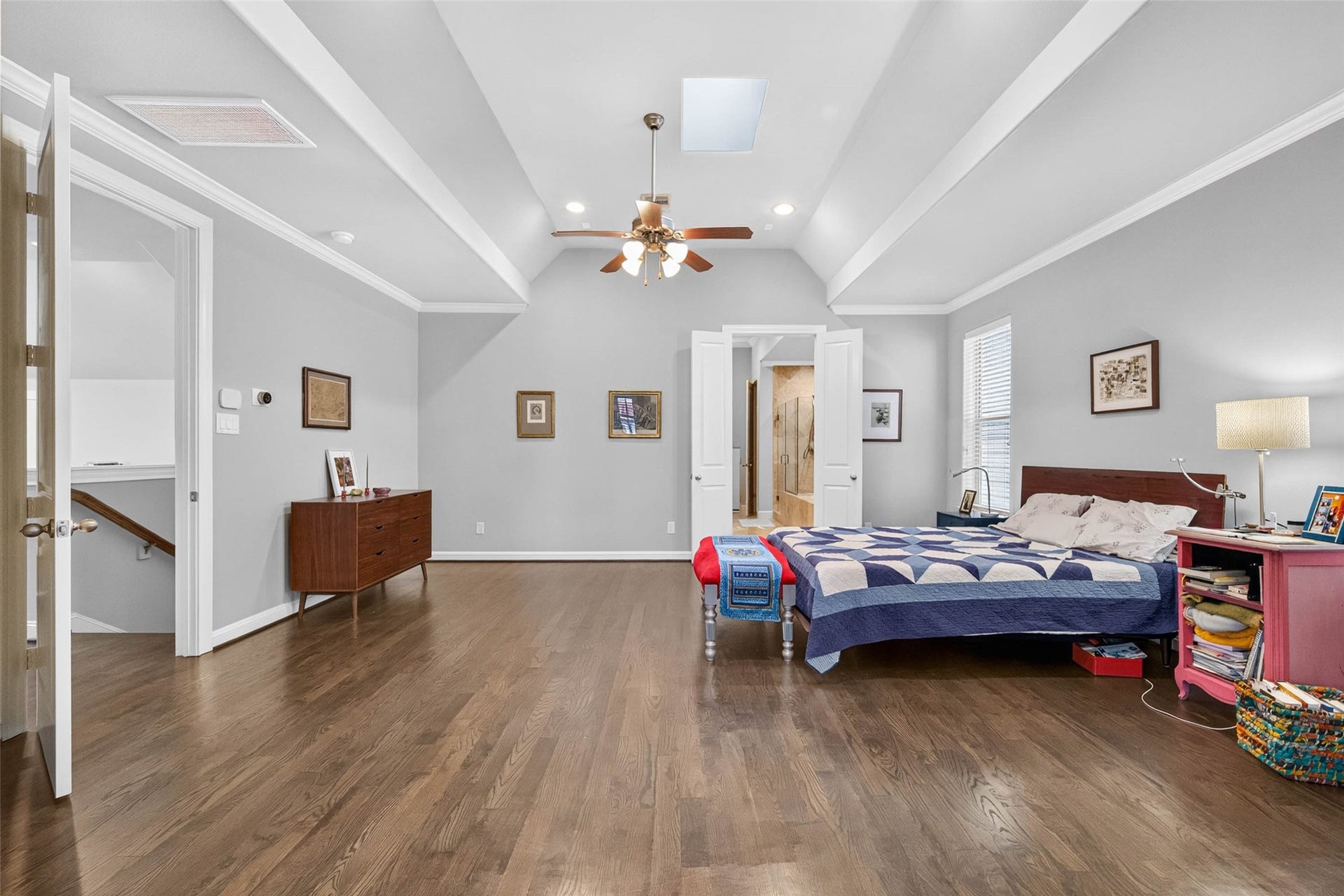 1207 Welch Street, Houston, TX 77006 High ceilings create an airy feel in the primary bedroom, with a skylight overhead and ample wall space to display artwork and make the room your own.