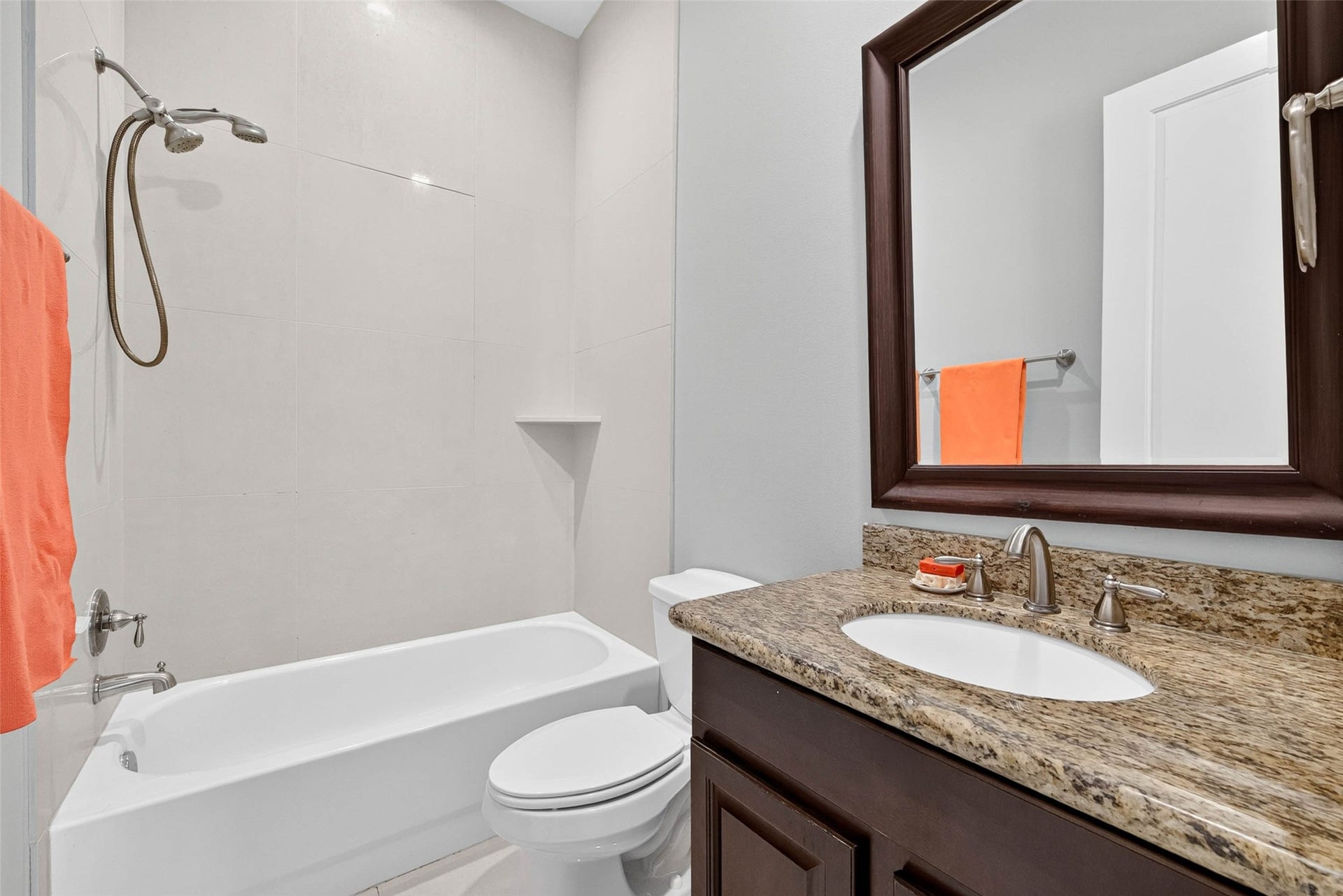 1207 Welch Street, Houston, TX 77006 The private ensuite bath features a convenient tub and shower combination, offering a functional setup for everyday use.