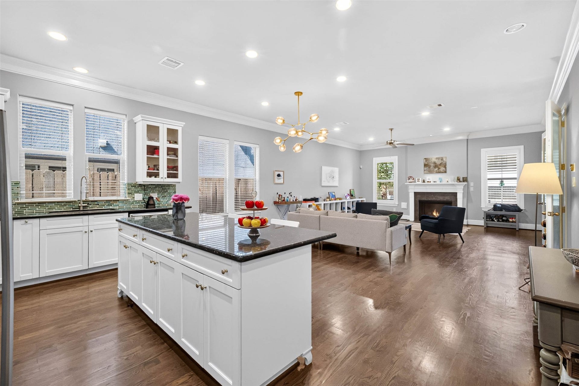 1207 Welch Street, Houston, TX 77006 An oversized island anchors the space, offering plenty of room for meal prep, casual gathering, and everyday living.