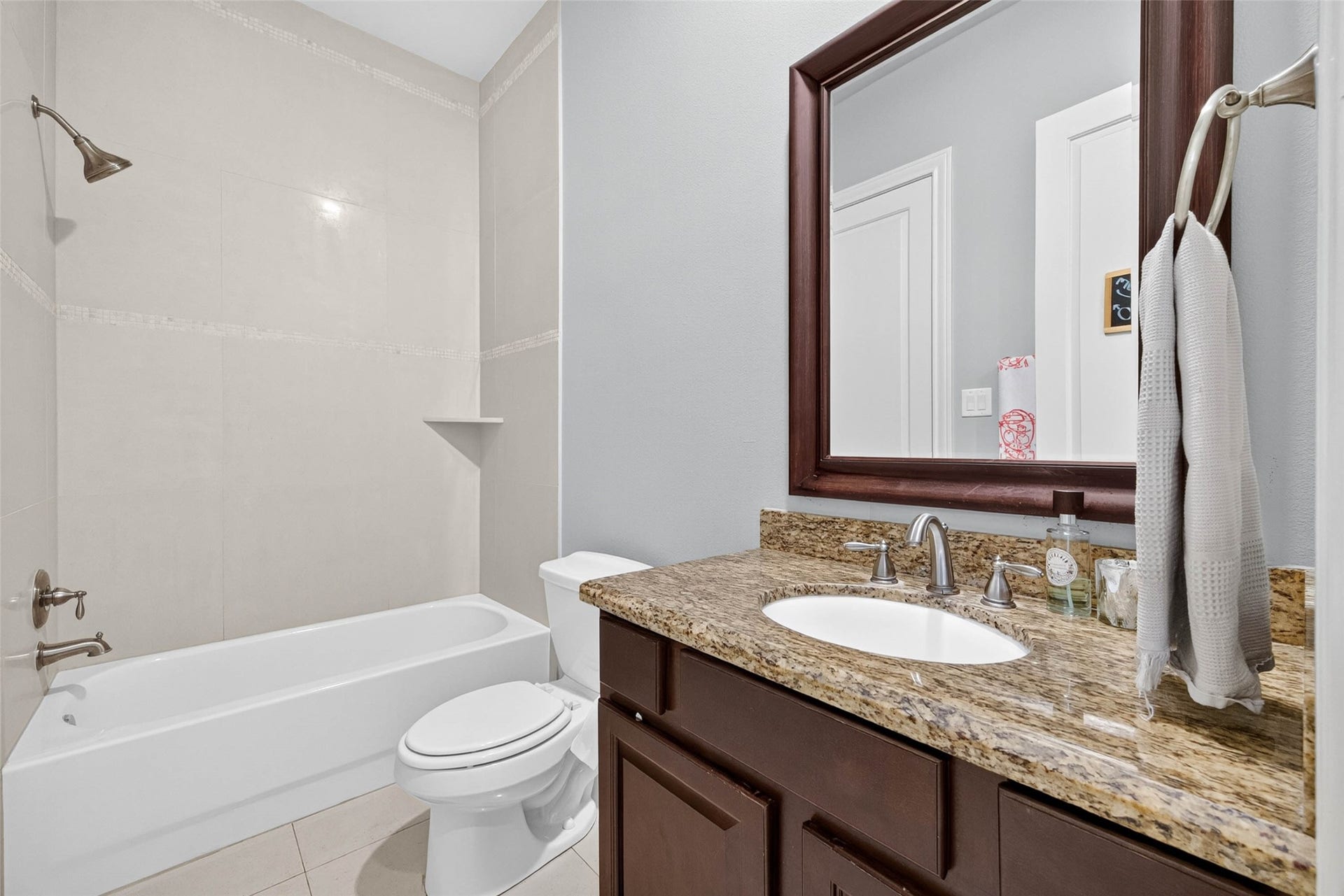 1207 Welch Street, Houston, TX 77006 The attached bathroom also opens to the hallway, offering convenient access for both the bedroom and guests.